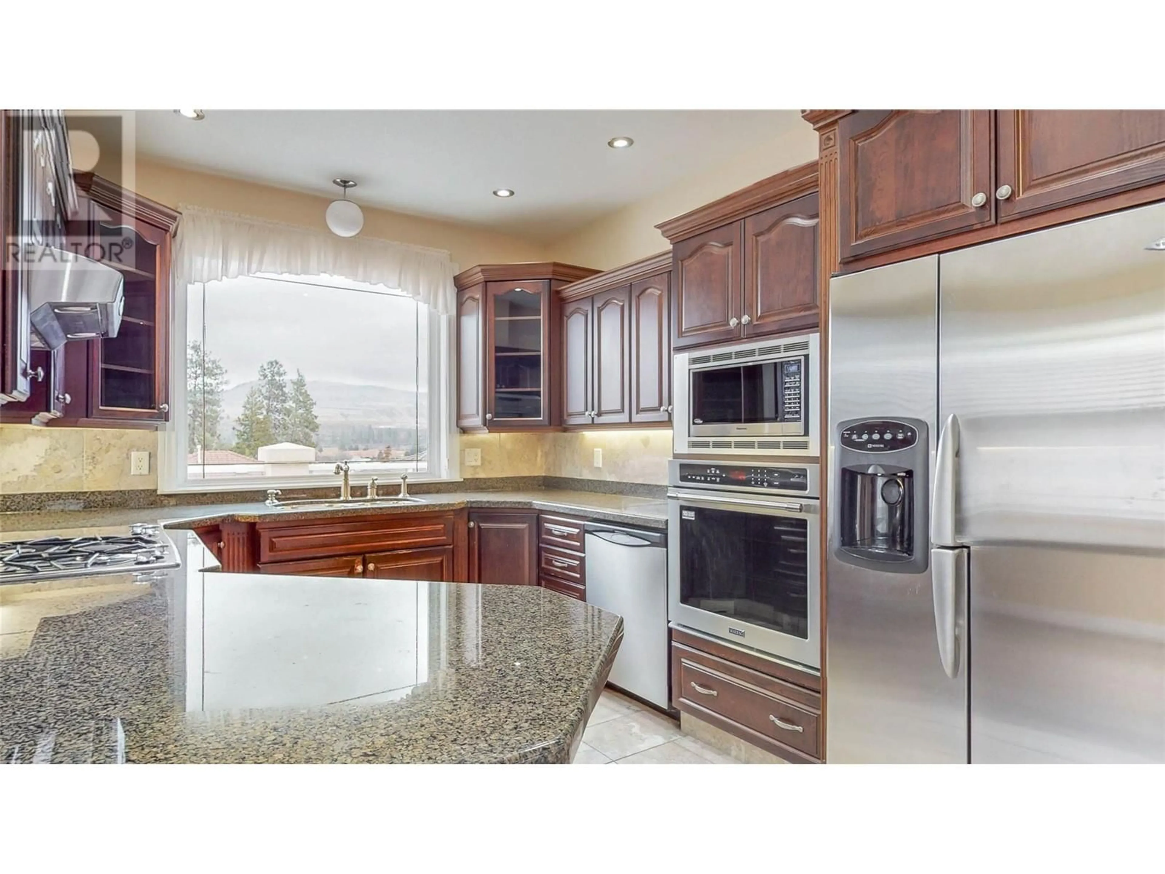 Open concept kitchen for 6812 Cabernet Place, Oliver British Columbia V0H1T4