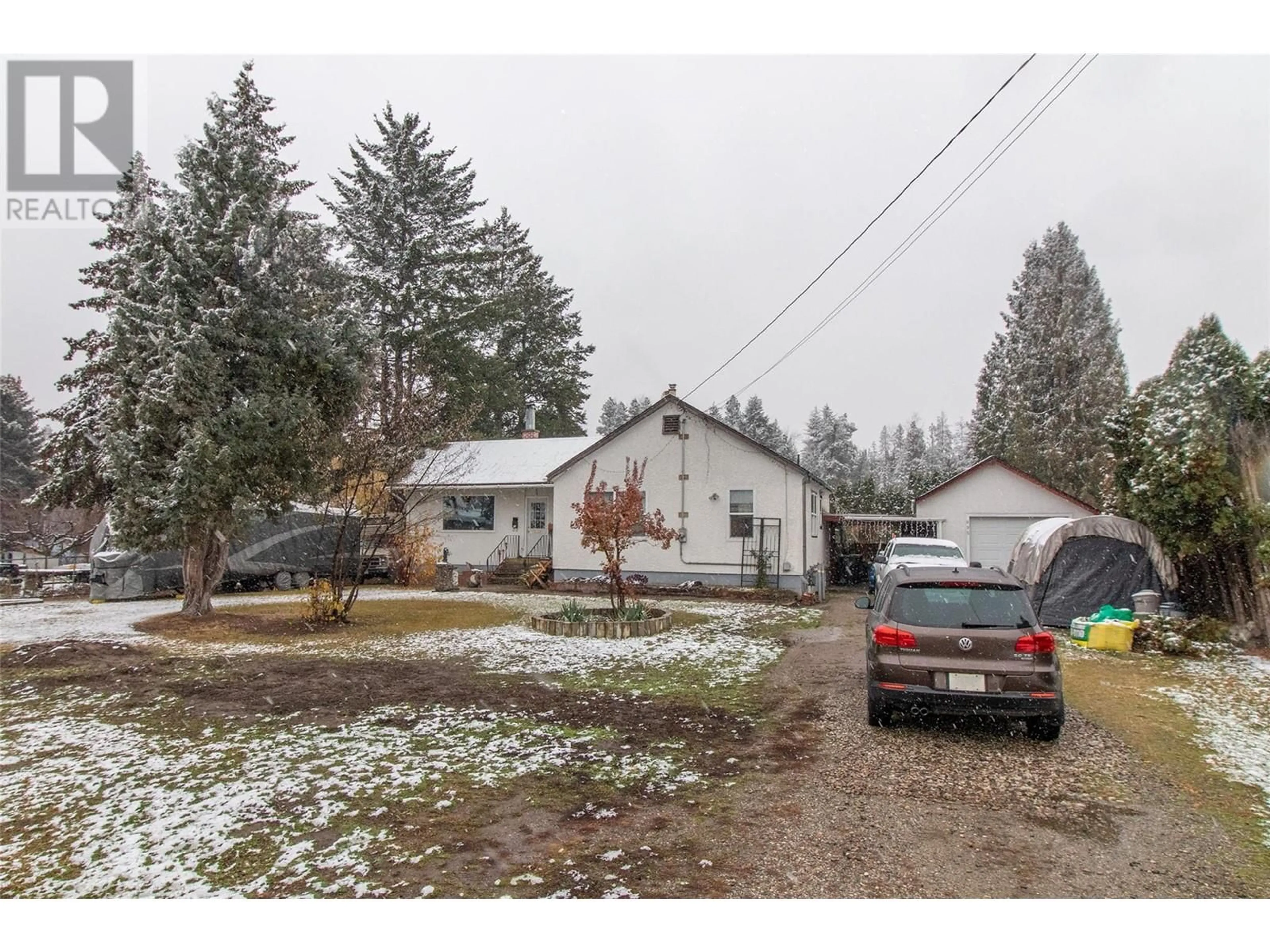 Frontside or backside of a home, the street view for 695 Bell Road, Kelowna British Columbia V1X2Y2