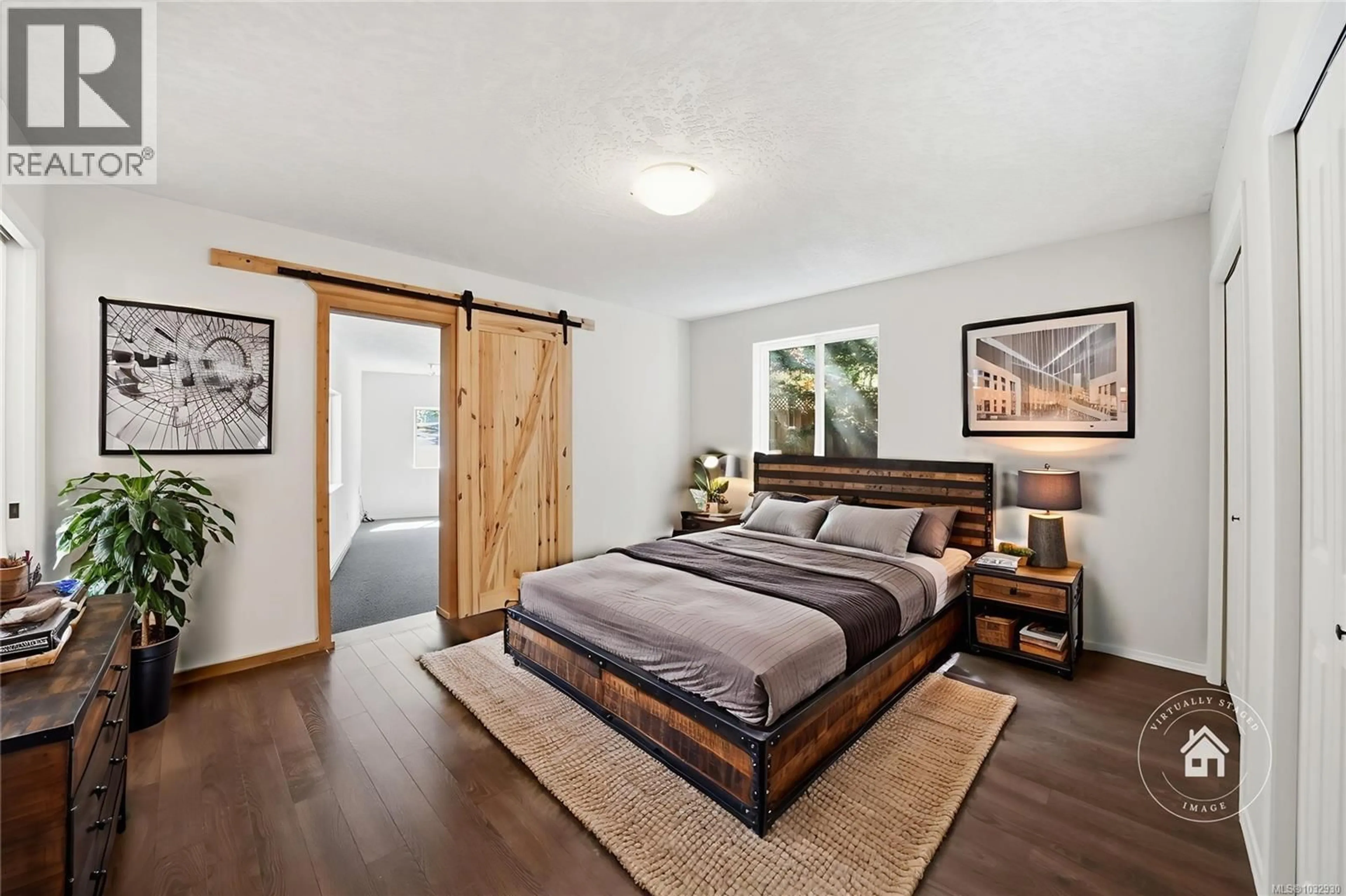 Bedroom with bed, wood/laminate floor for 1719 MIAMA COURT, Qualicum Beach British Columbia V9K2S3