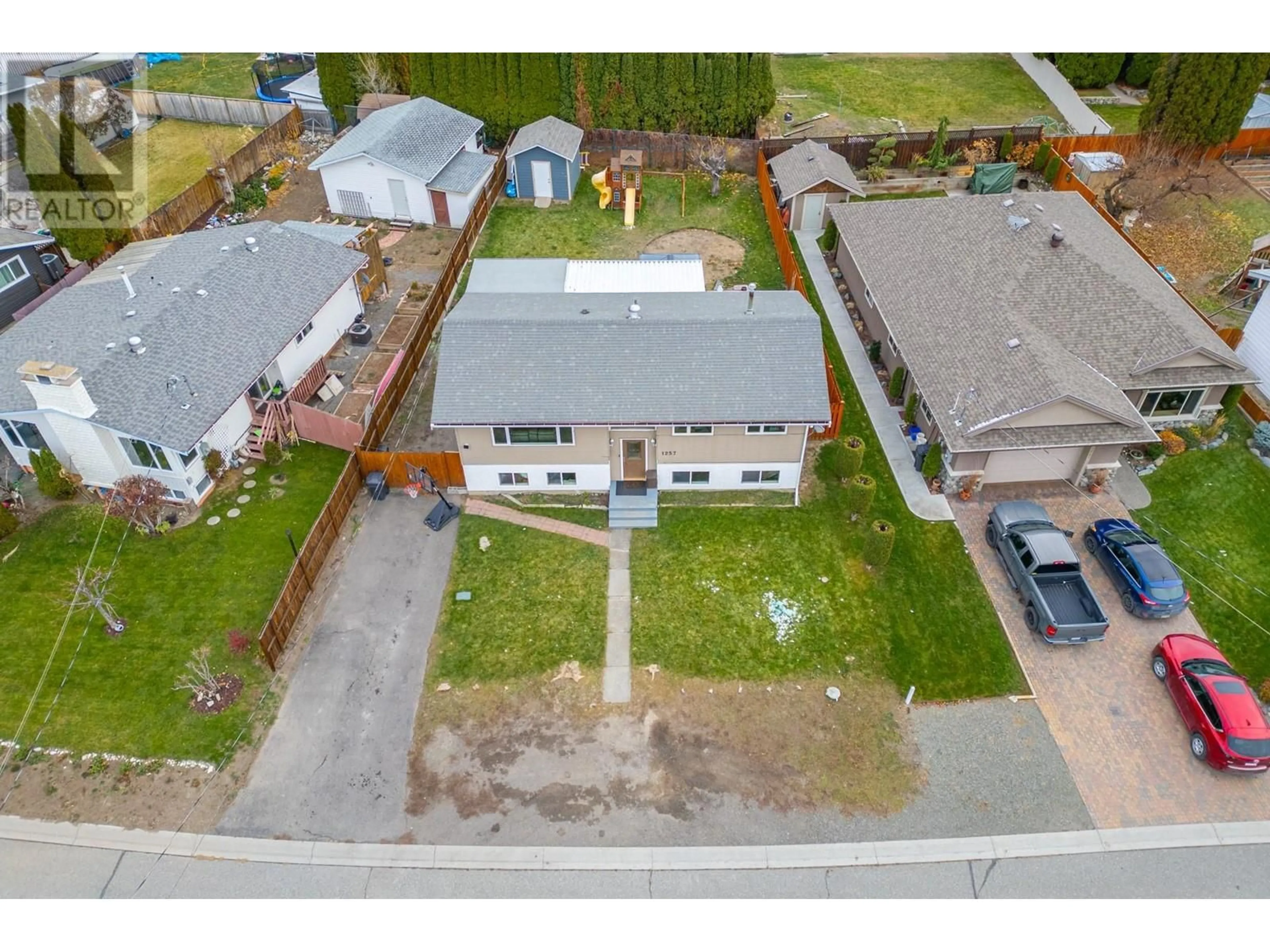 Frontside or backside of a home, the fenced backyard for 1257 Mesa Vista Drive, Ashcroft British Columbia V0K1A0