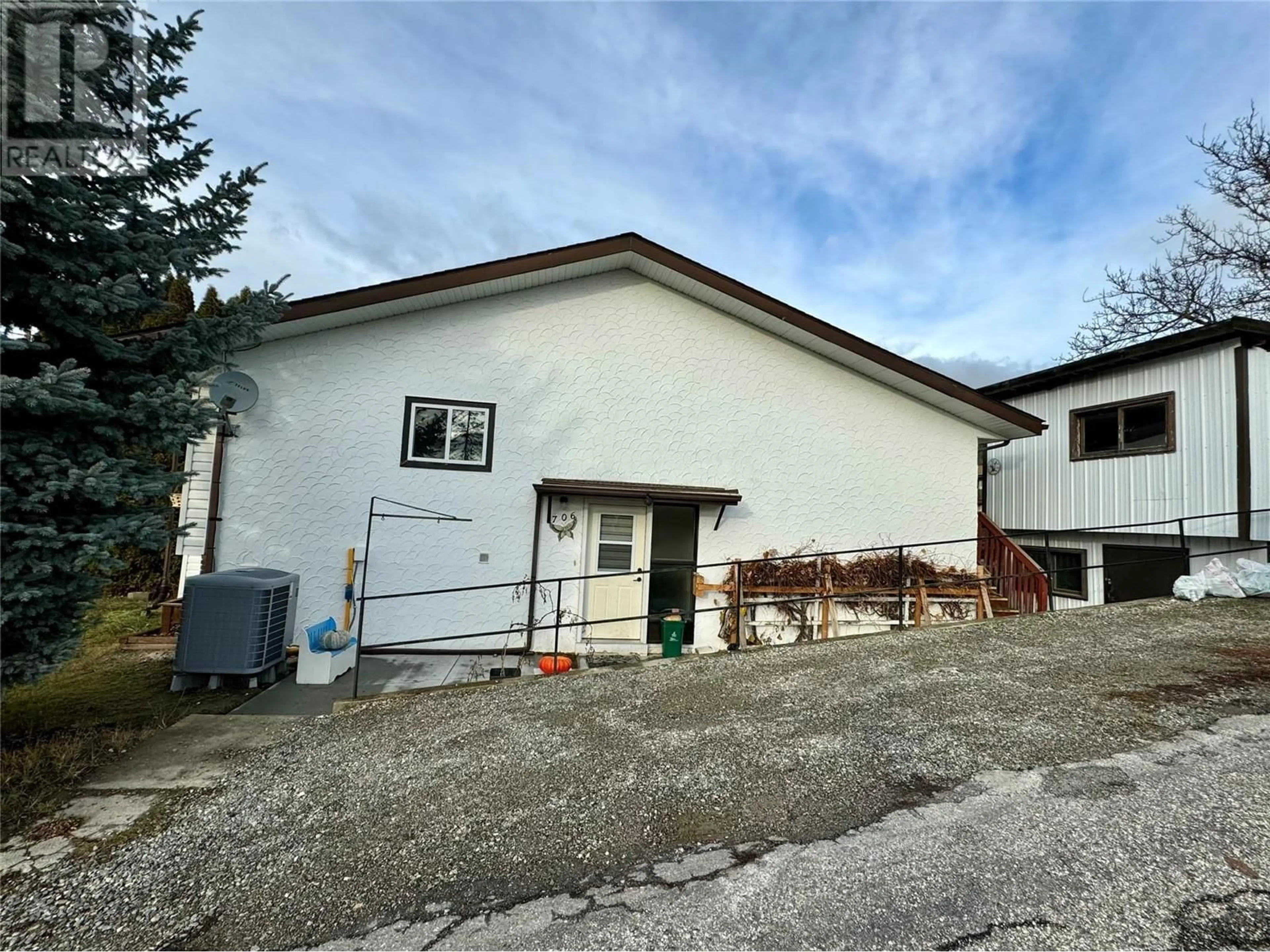 Frontside or backside of a home, the front or back of building for 706 CEDAR Street, Creston British Columbia V0B1G3