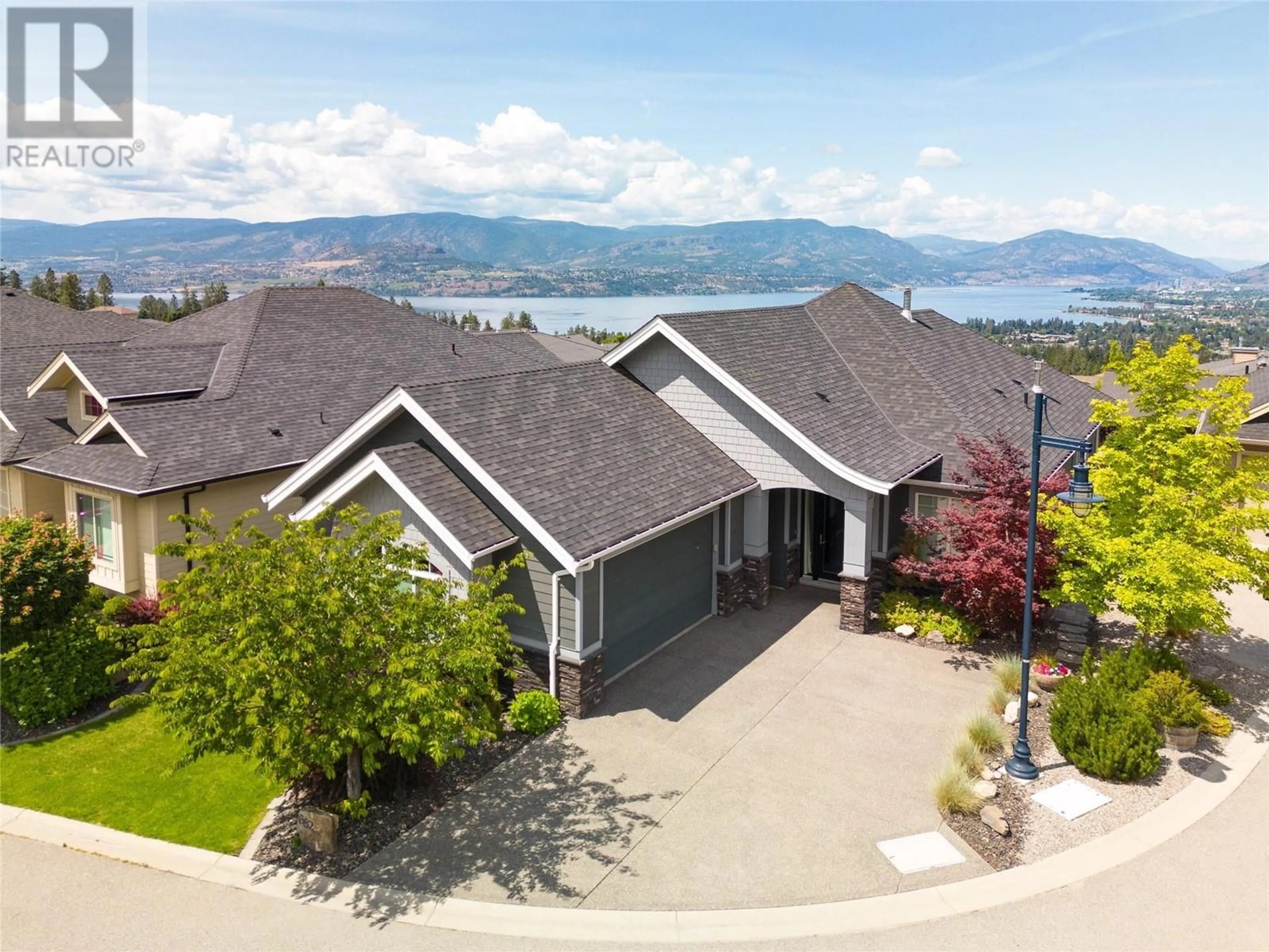A pic from outside/outdoor area/front of a property/back of a property/a pic from drone, mountain view for 682 PERIDOT COURT, Kelowna British Columbia V1W5E7
