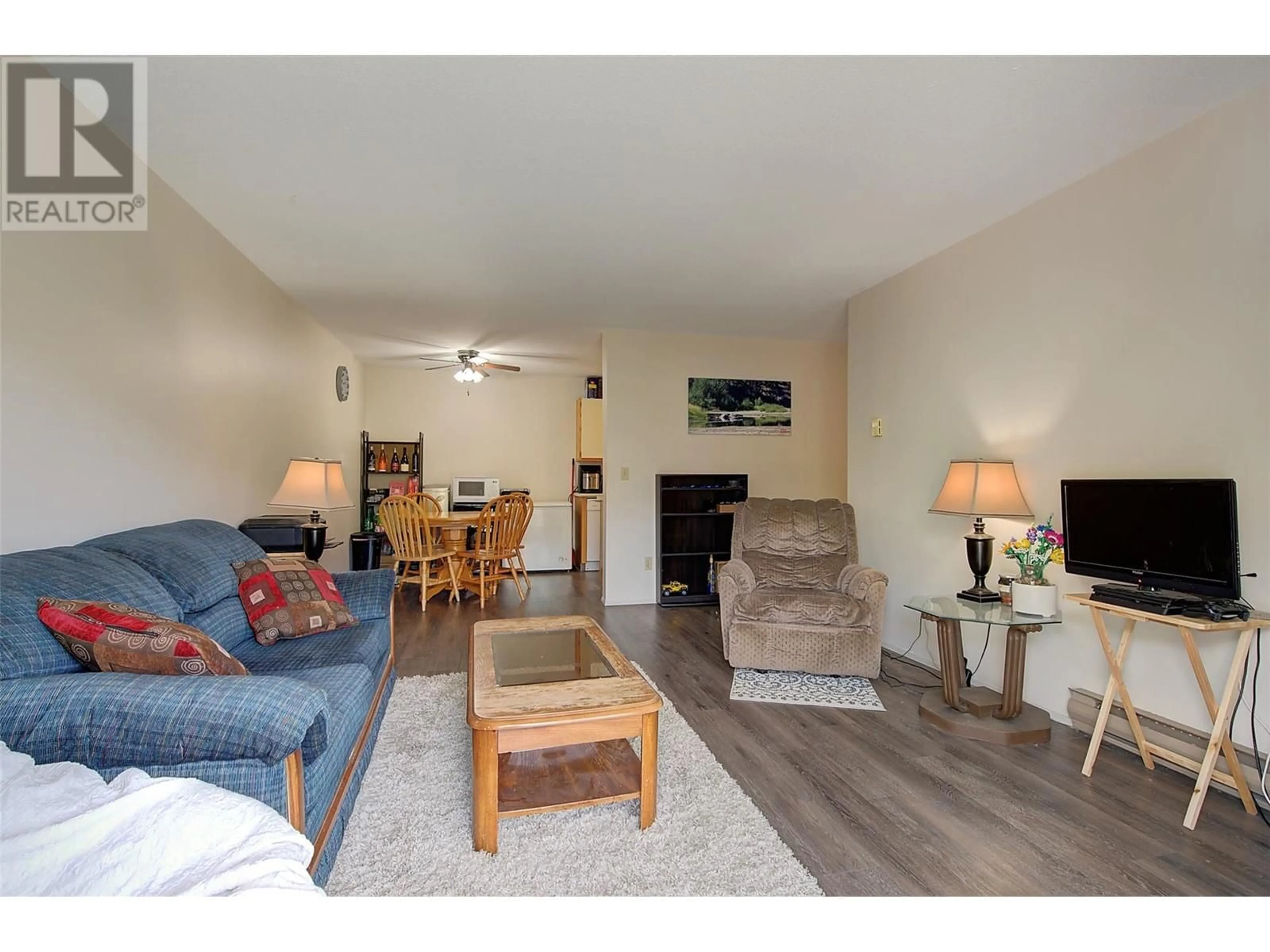 Living room, wood floors for 3160 De Montreuil Court Unit# 203, Kelowna British Columbia V1W3W3