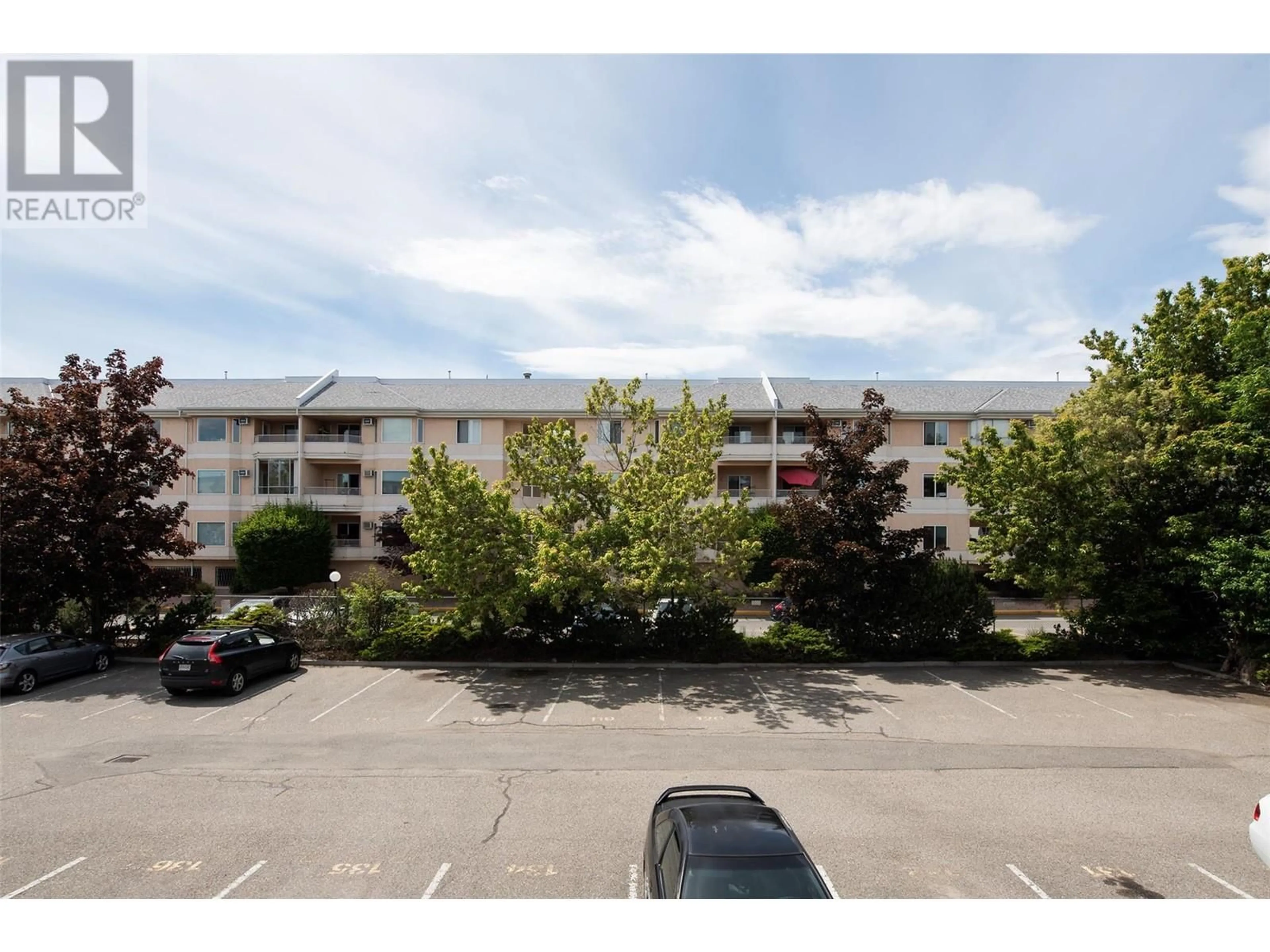 A pic from exterior of the house or condo, the street view for 3160 De Montreuil Court Unit# 203, Kelowna British Columbia V1W3W3