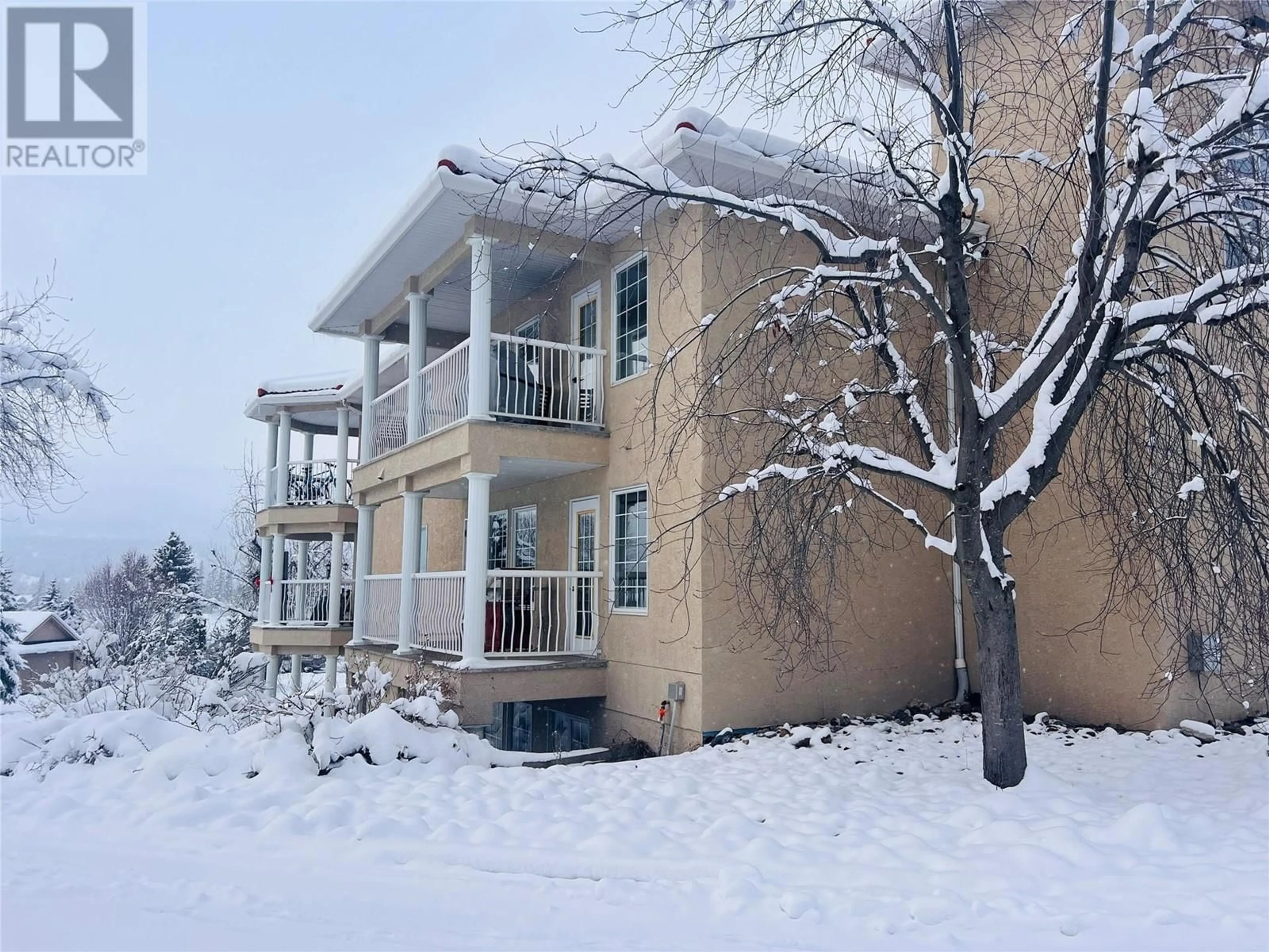 A pic from exterior of the house or condo, the front or back of building for 5052 Riverview Road Road Unit# 5005B, Fairmont Hot Springs British Columbia V0B1L1