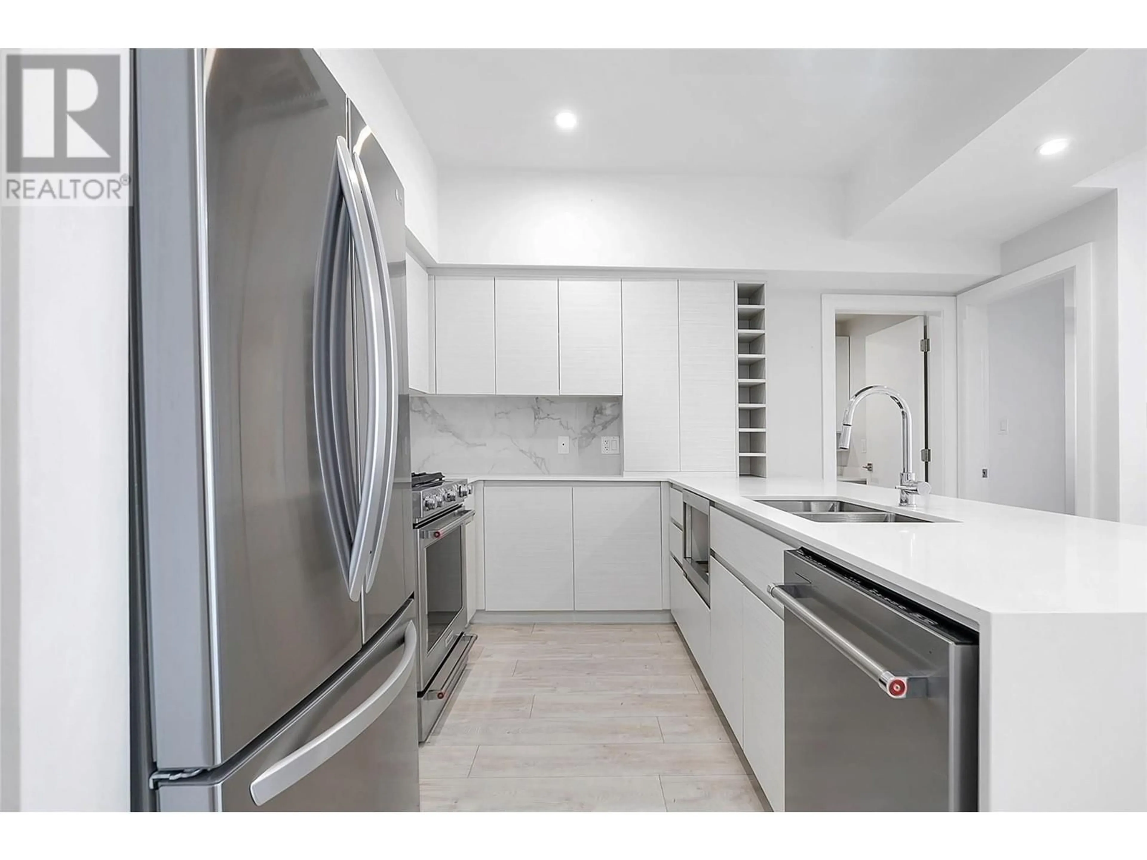 Contemporary kitchen, ceramic floors for 1925 Enterprise Way Unit# 205, Kelowna British Columbia V1Y9S9