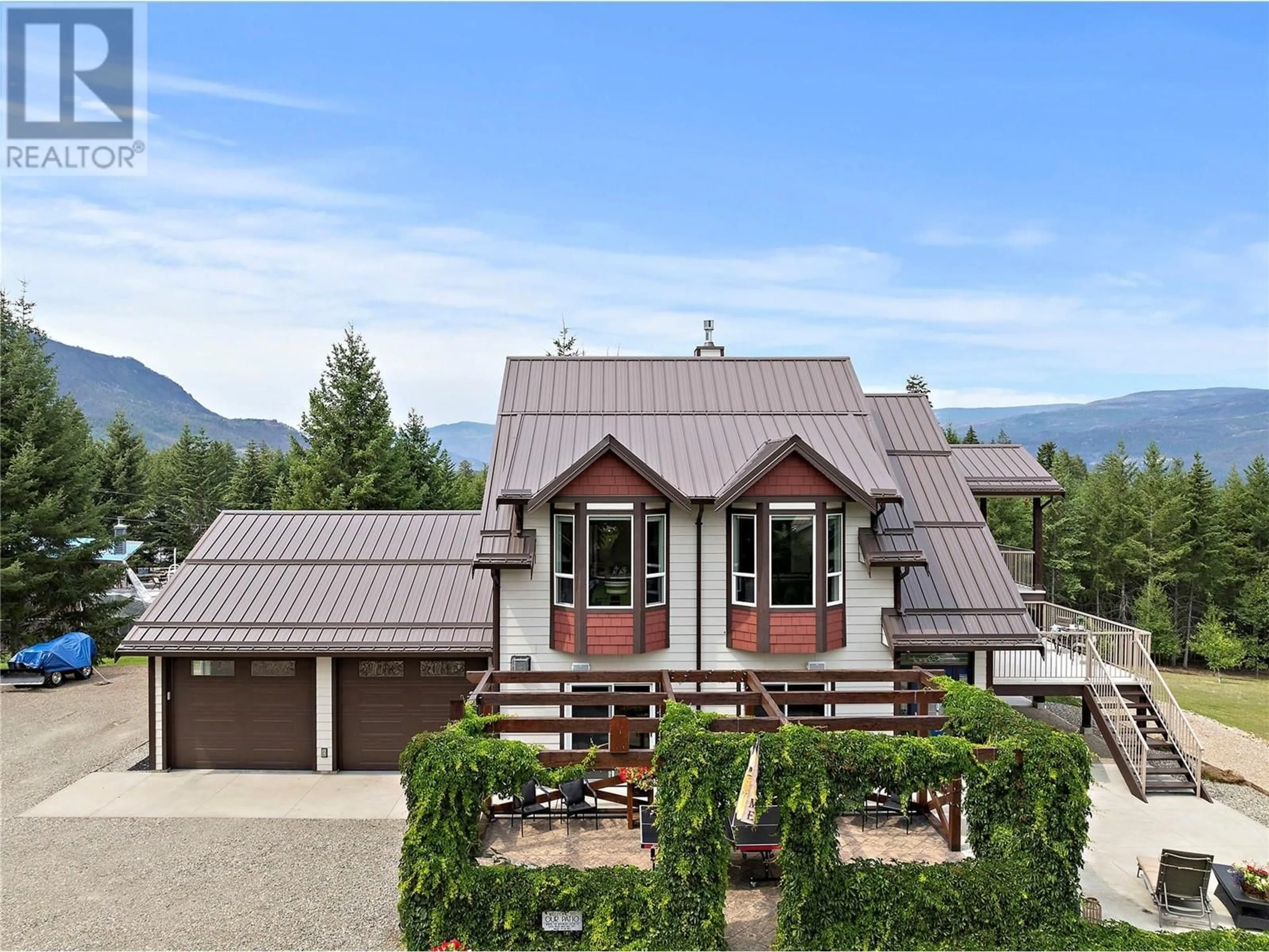 Home with vinyl exterior material, mountain view for 2672 McKenzie Road, Sorrento British Columbia V0E2W1