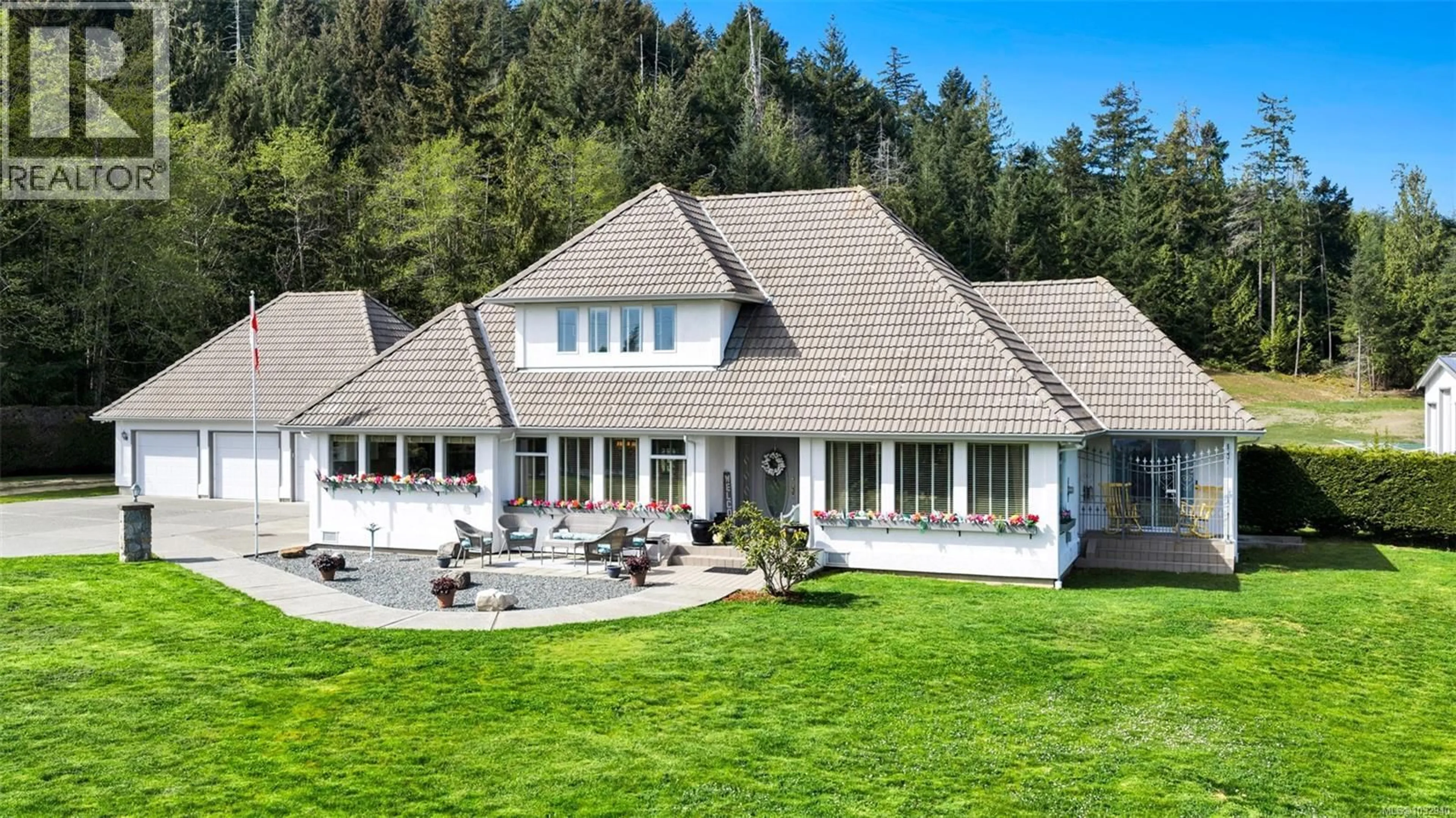 A pic from outside/outdoor area/front of a property/back of a property/a pic from drone, mountain view for 2304 BOULDING ROAD, Mill Bay British Columbia V8H1B6