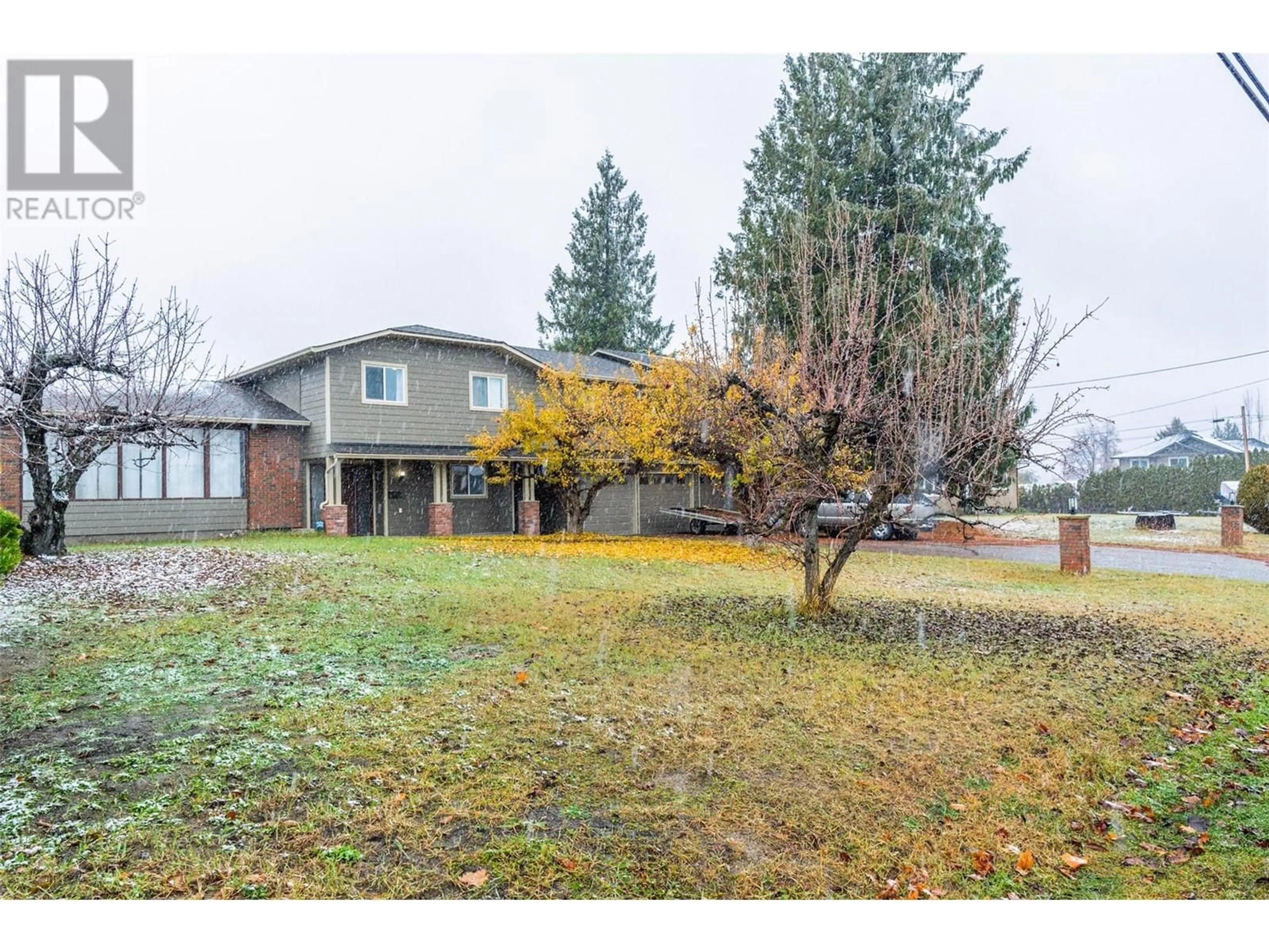 Frontside or backside of a home, the fenced backyard for 2308 Thacker Drive, West Kelowna British Columbia V1Z1V7