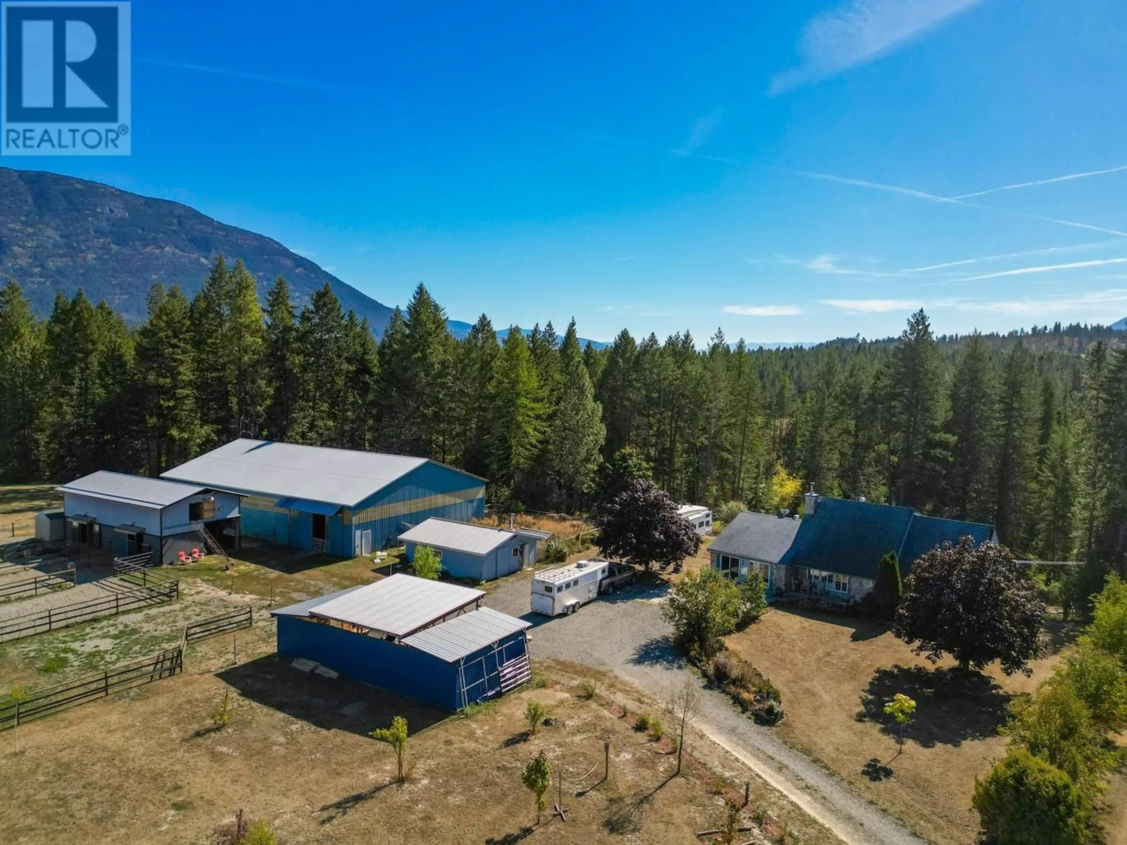 Frontside or backside of a home, the fenced backyard for 552 WELLSPRING Road, Creston British Columbia V0B1G2