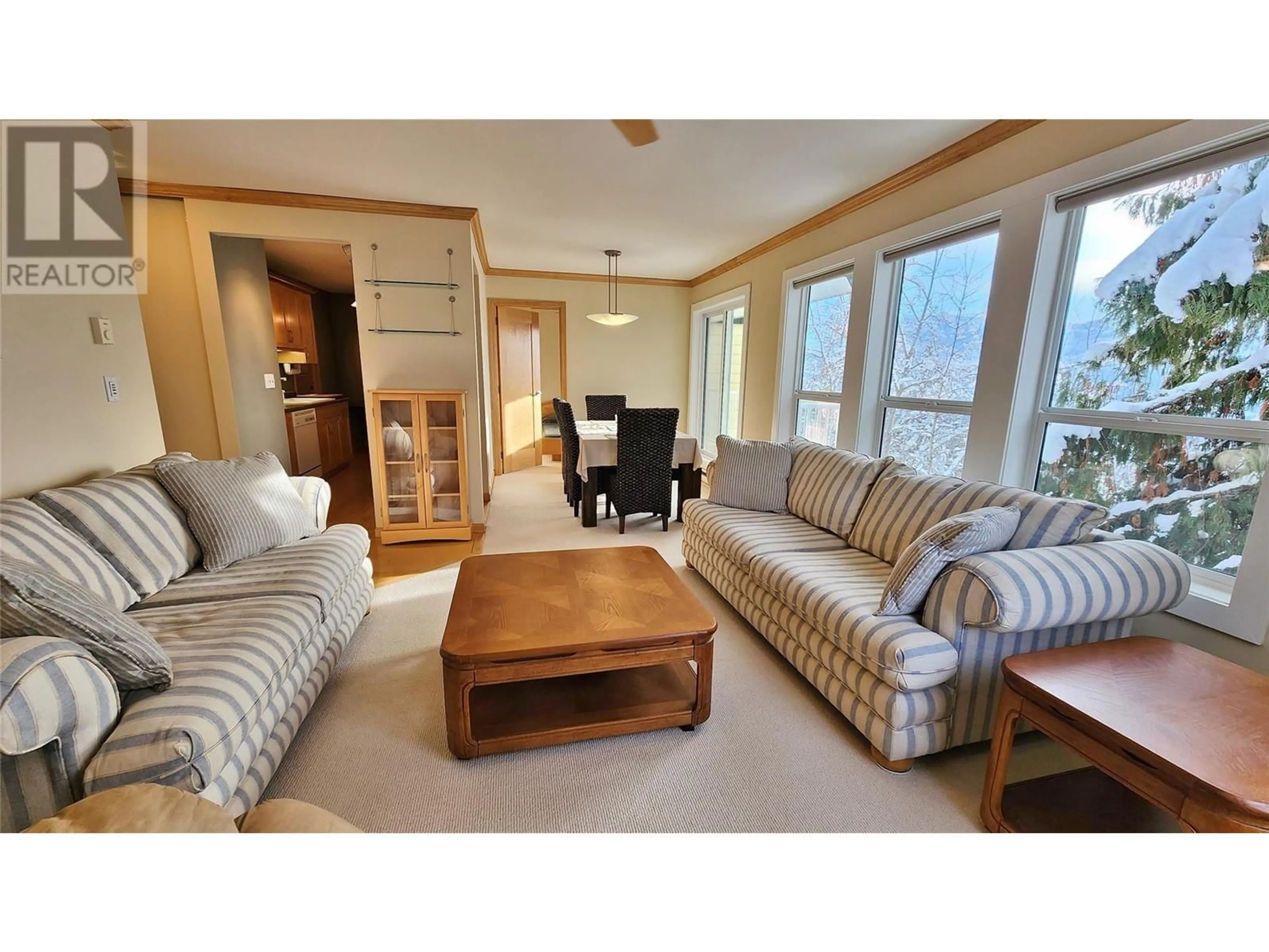 Living room with furniture, wood/laminate floor for 407 - 1611 NICKLEPLATE ROAD, Rossland British Columbia V0G1Y0