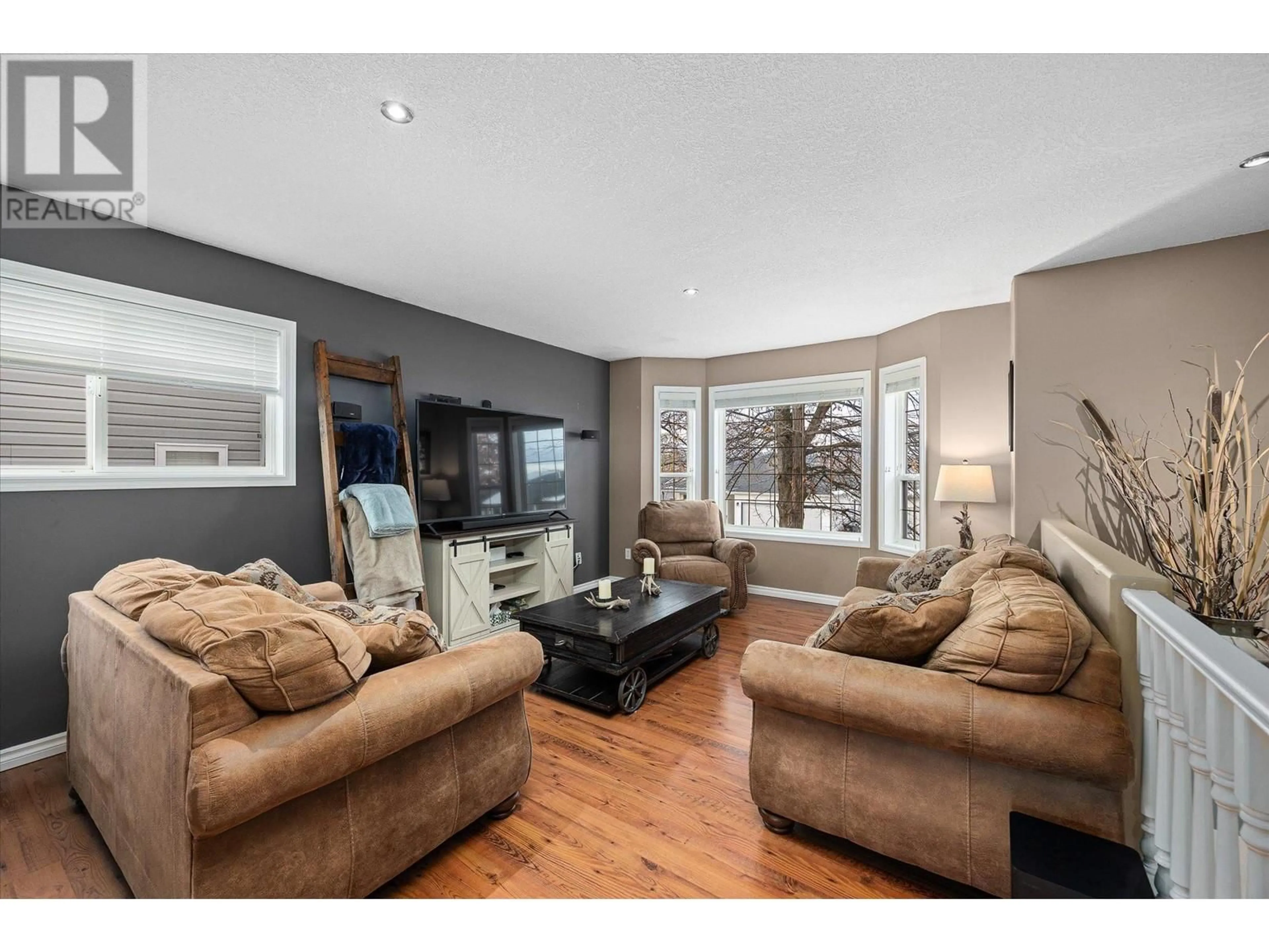 Living room, wood floors for 4450 Postill Drive Unit# 7, Kelowna British Columbia V1X7T9