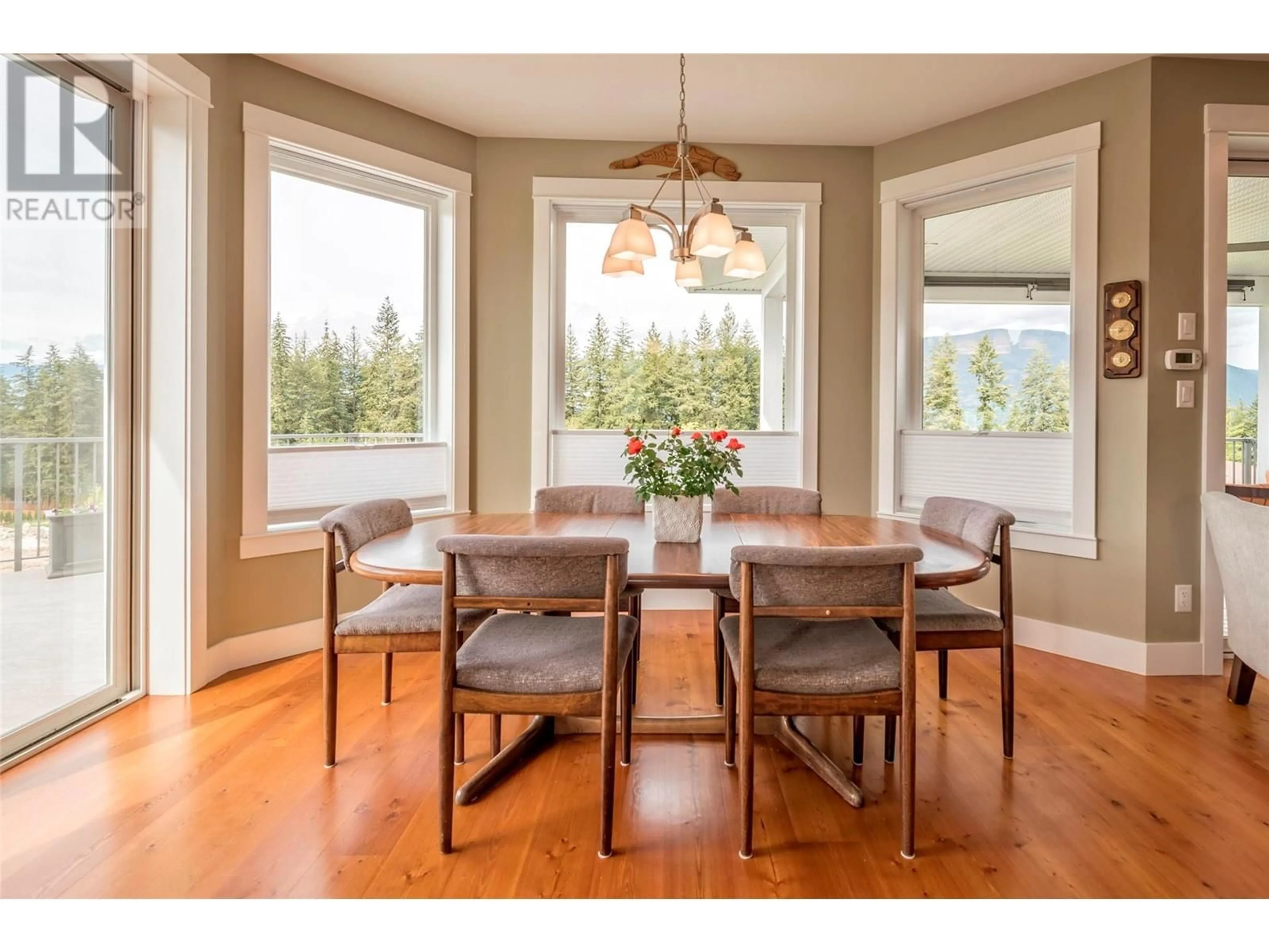 Dining room, wood floors, mountain for 4230 20 Street NE, Salmon Arm British Columbia V1E2G9