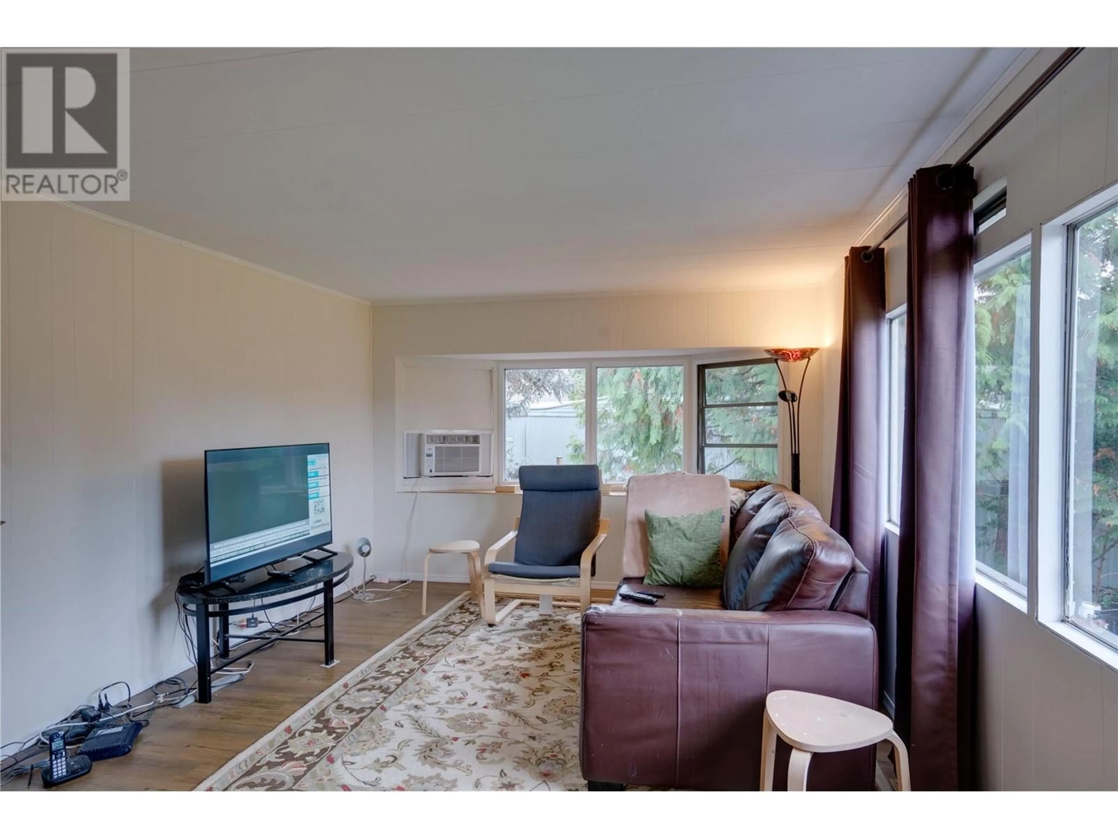 Living room, wood floors for 2544 Willow Park Road, Vernon British Columbia V1T6L7