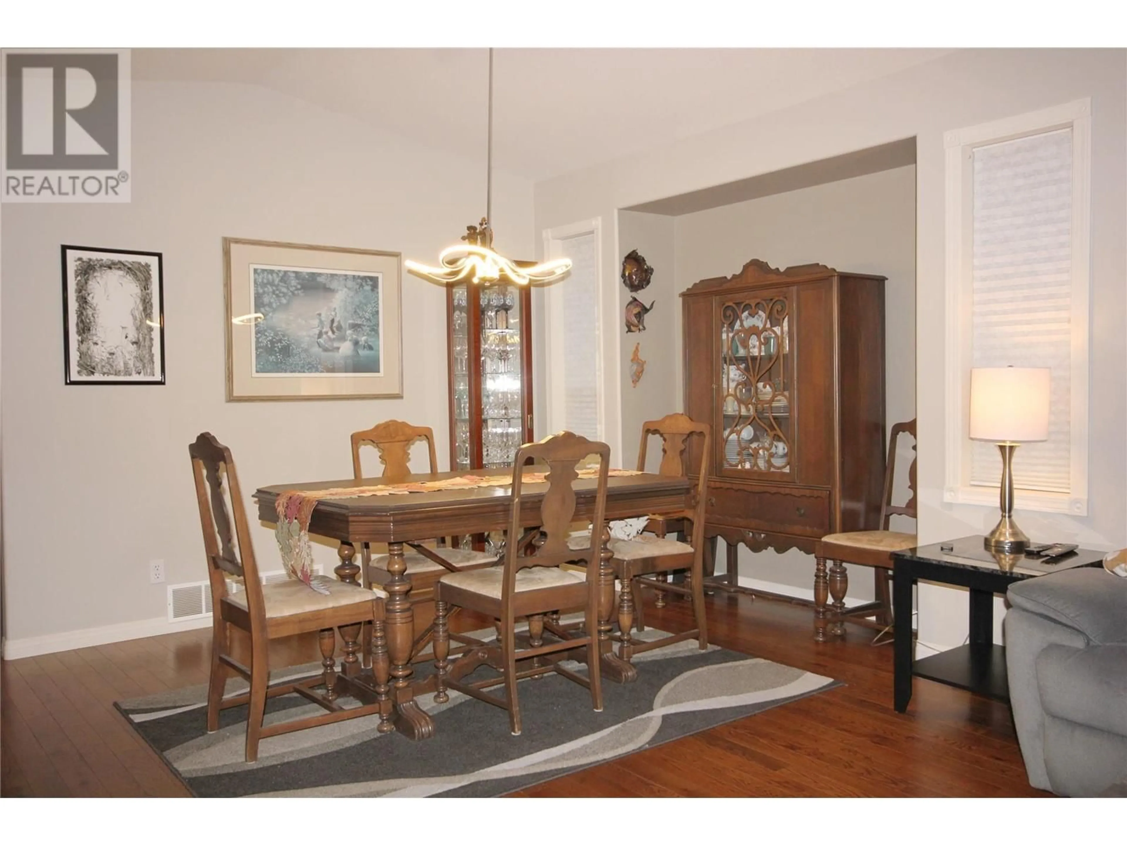 Dining room, wood floors, cottage for 1634 Carmi Avenue Unit# 129, Penticton British Columbia V2A8K5