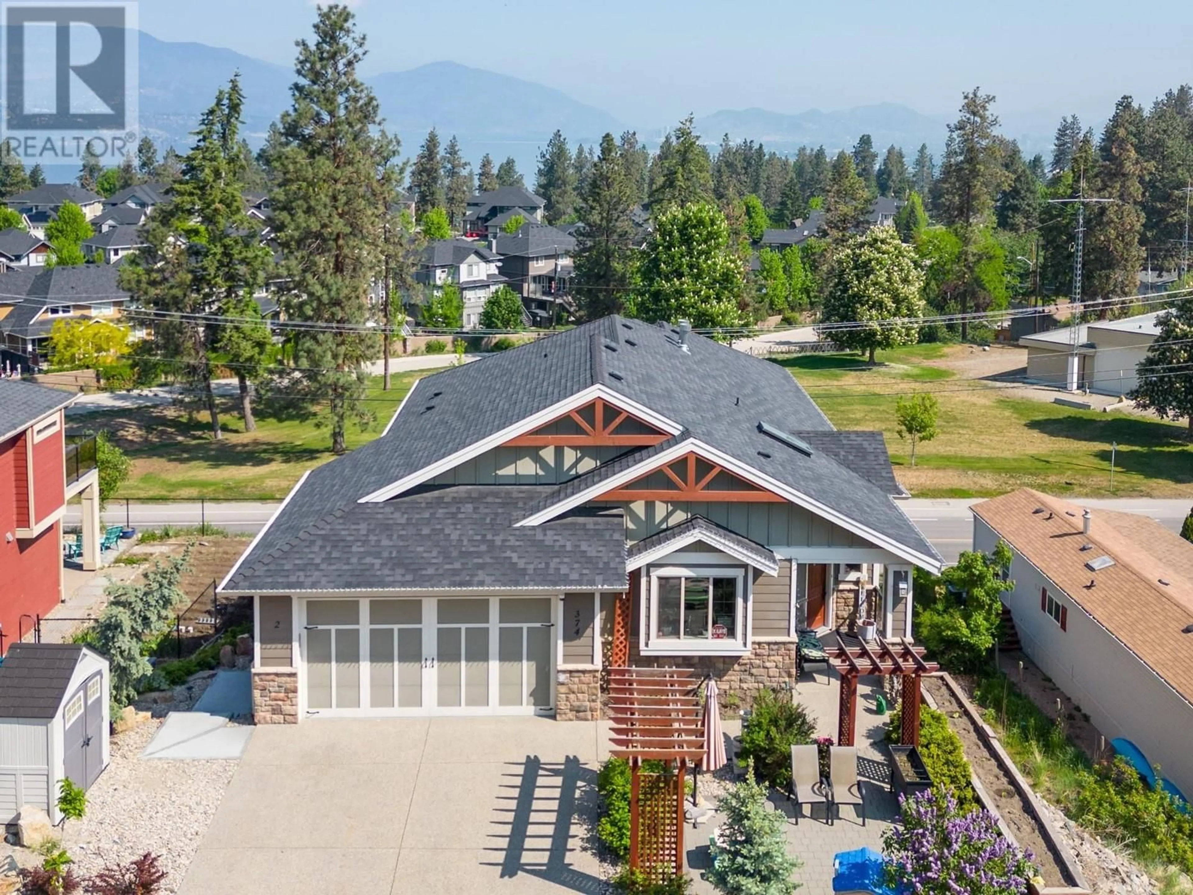 Frontside or backside of a home, cottage for 374 Trumpeter Court, Kelowna British Columbia V1W5J4