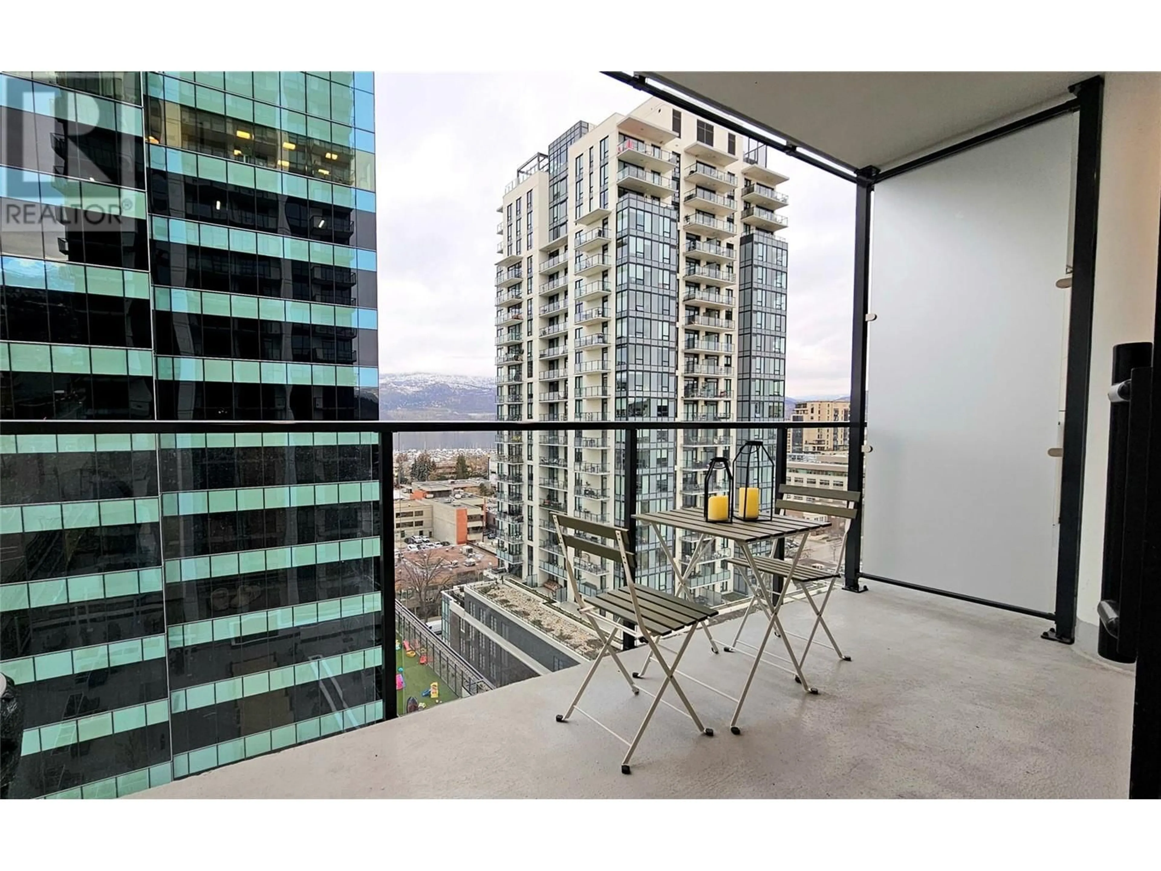 A pic from exterior of the house or condo, the view of city buildings for 1488 Bertram Street Unit# 1301, Kelowna British Columbia V1Y6P2