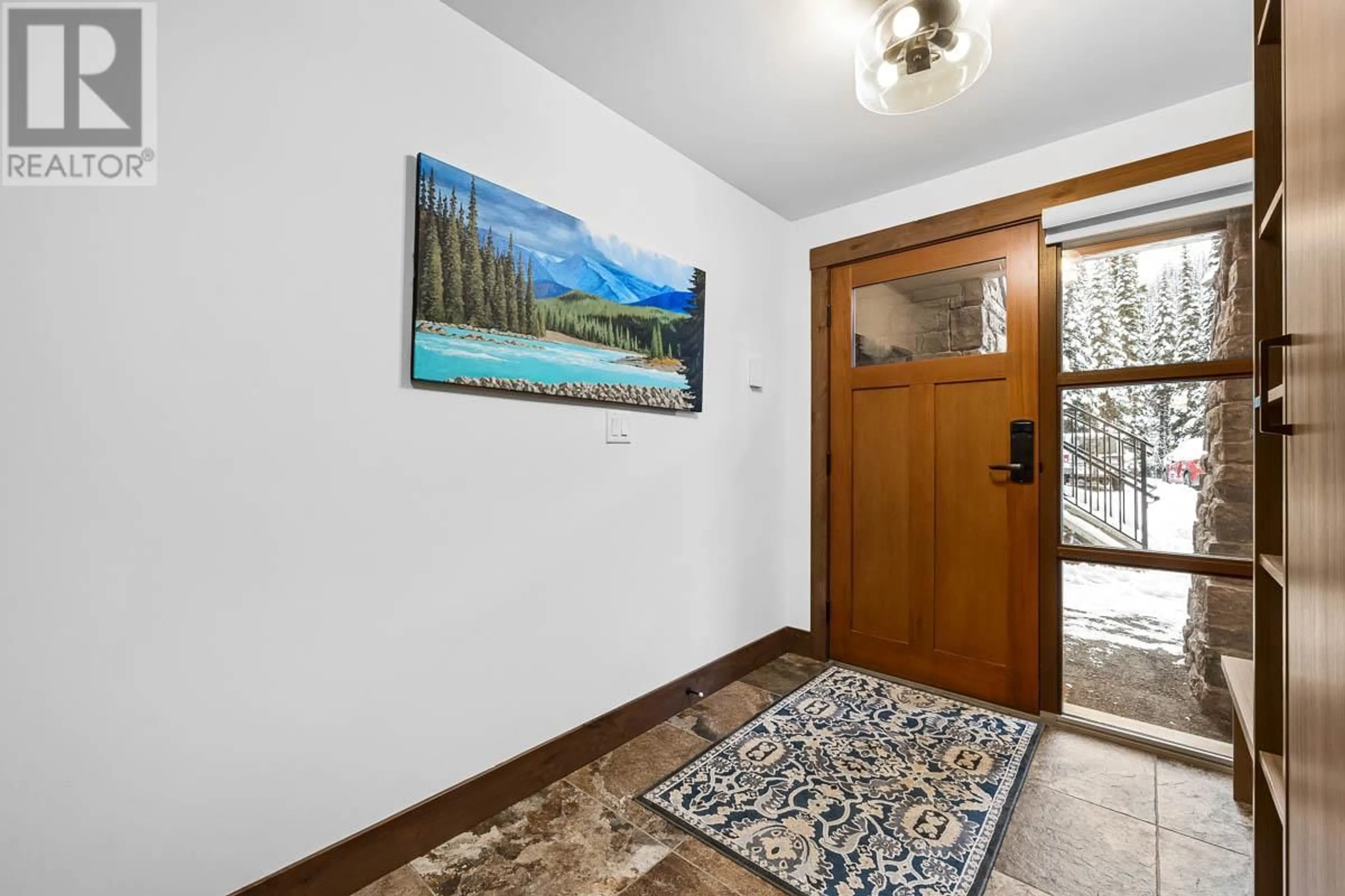 Indoor foyer, wood floors for 3280 Village Way Unit# 22, Sun Peaks British Columbia V0E5N0