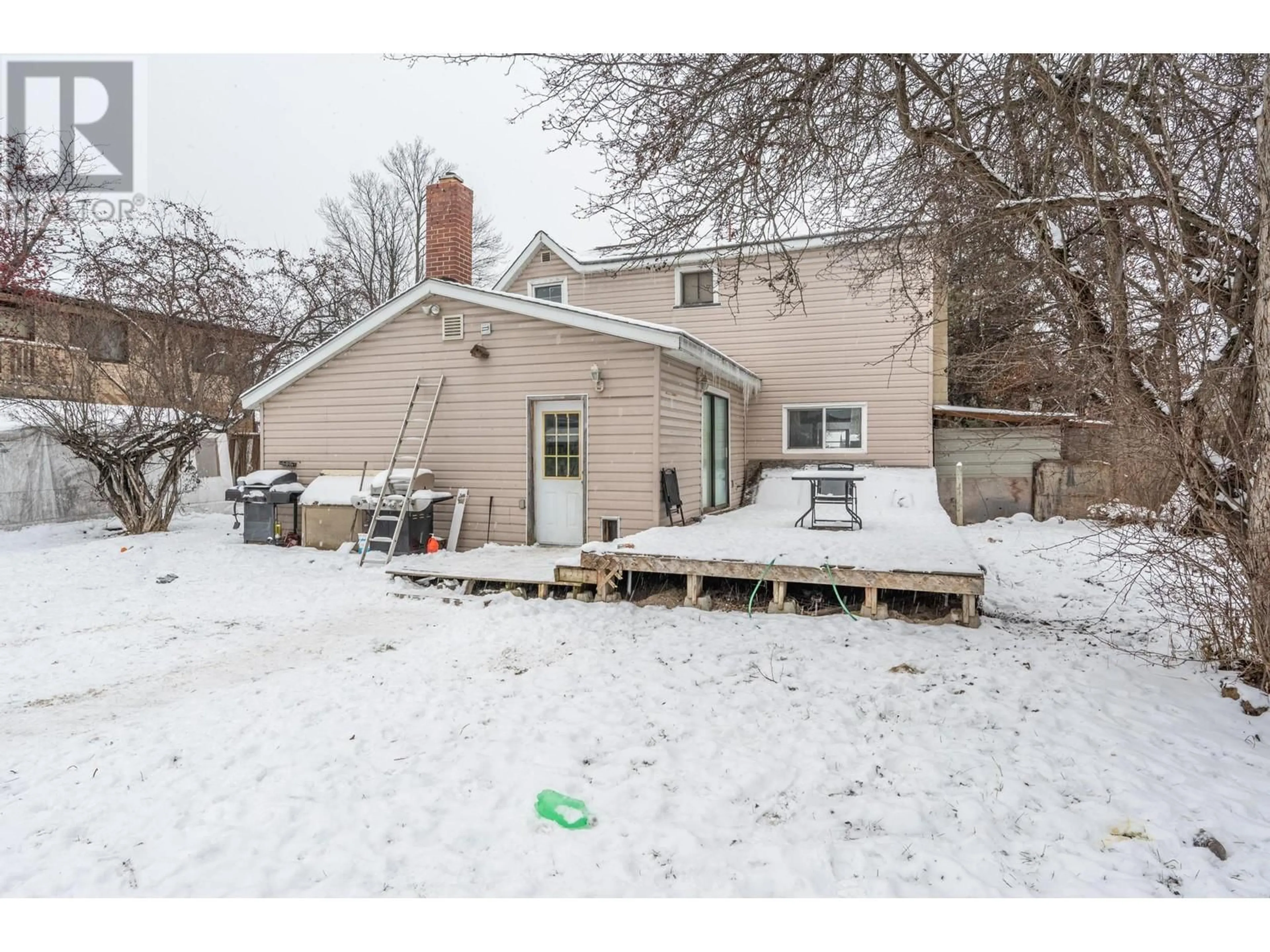 Frontside or backside of a home, the fenced backyard for 715 9TH  S Street S, Golden British Columbia V0A1H0