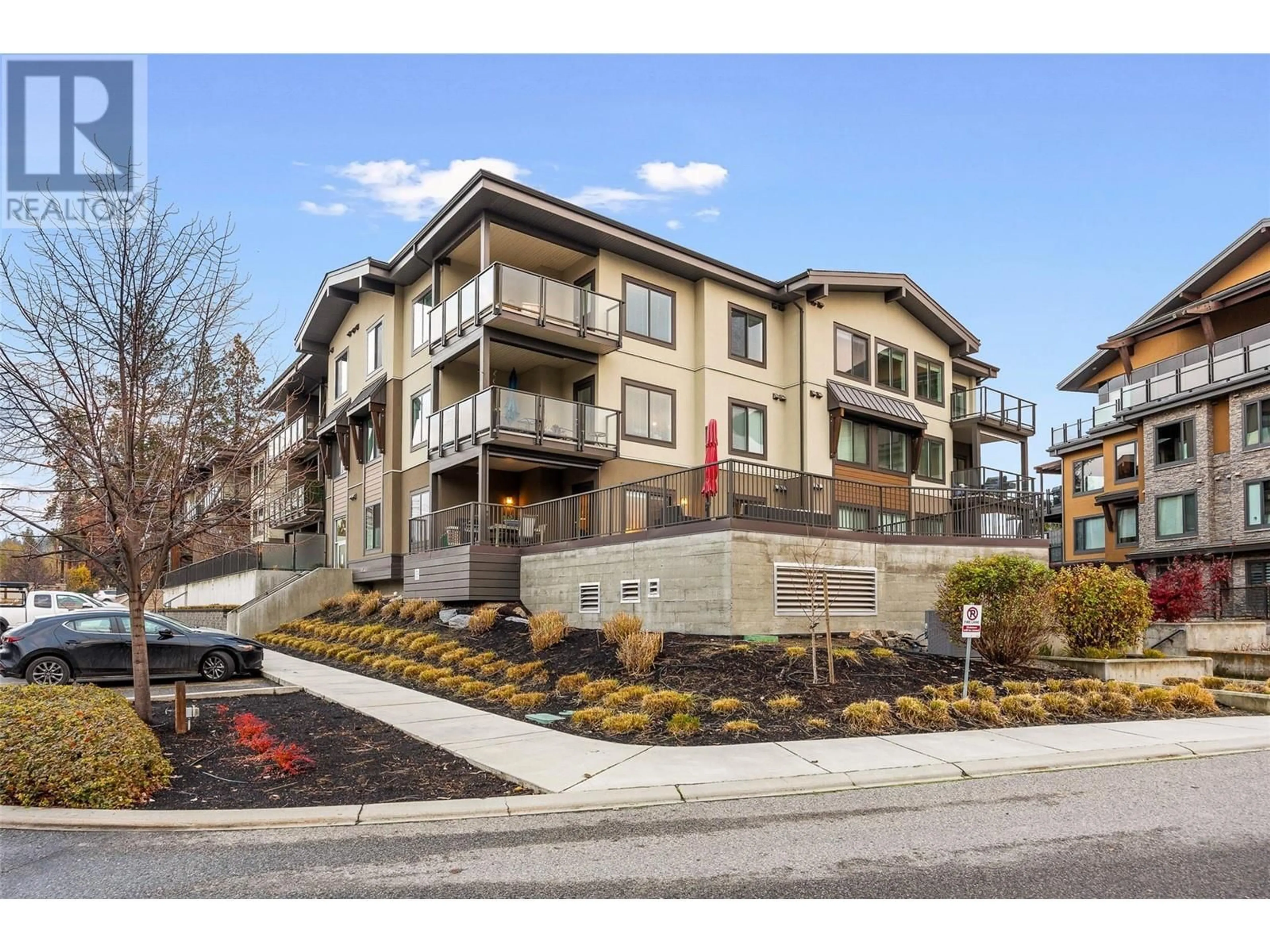 A pic from exterior of the house or condo, the street view for 4380 Lakeshore Road Unit# 107, Kelowna British Columbia V1W5N3