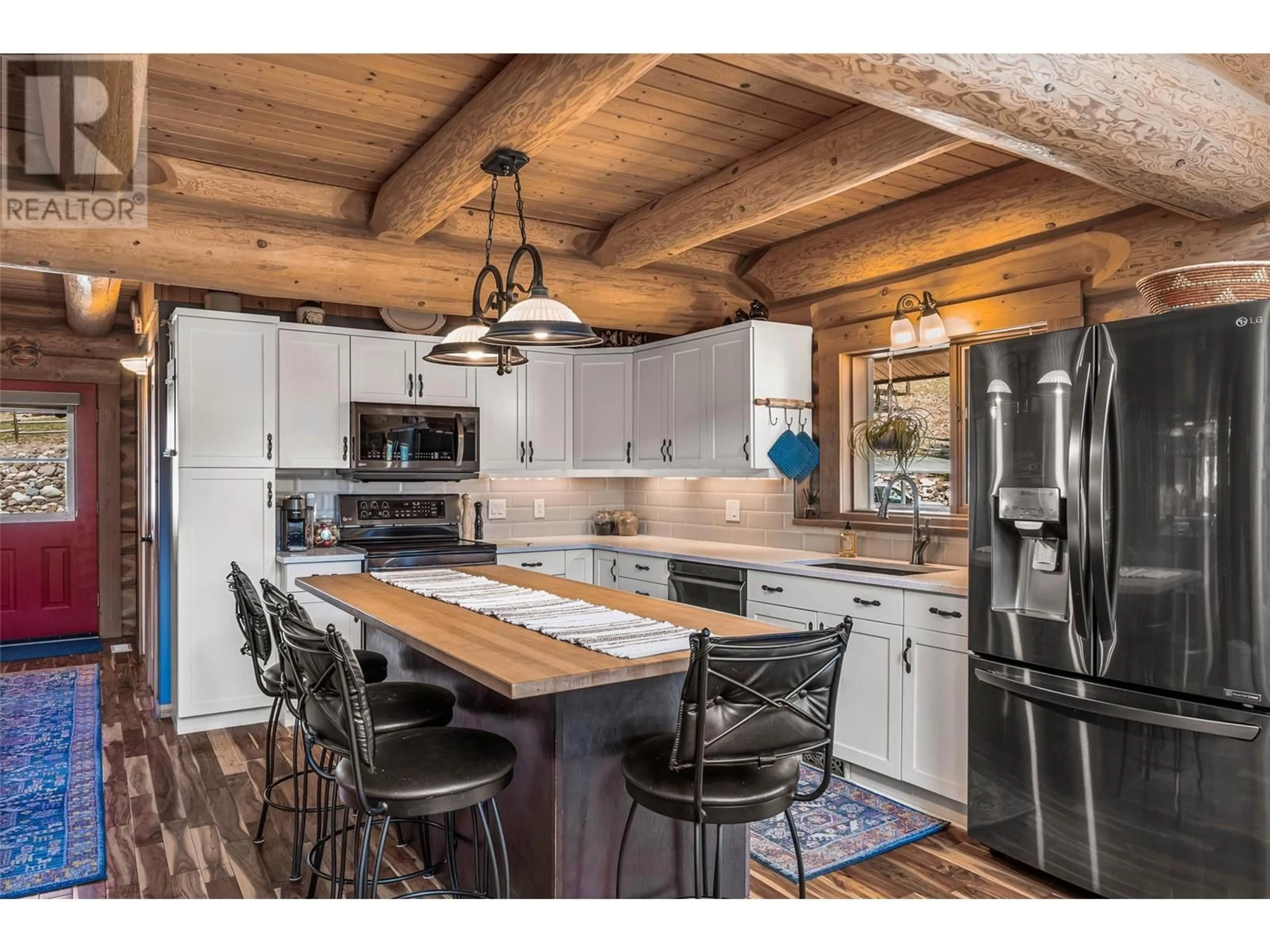 Rustic kitchen, wood/laminate floor for 1761 MILLER ROAD, Merritt British Columbia V1K1R8