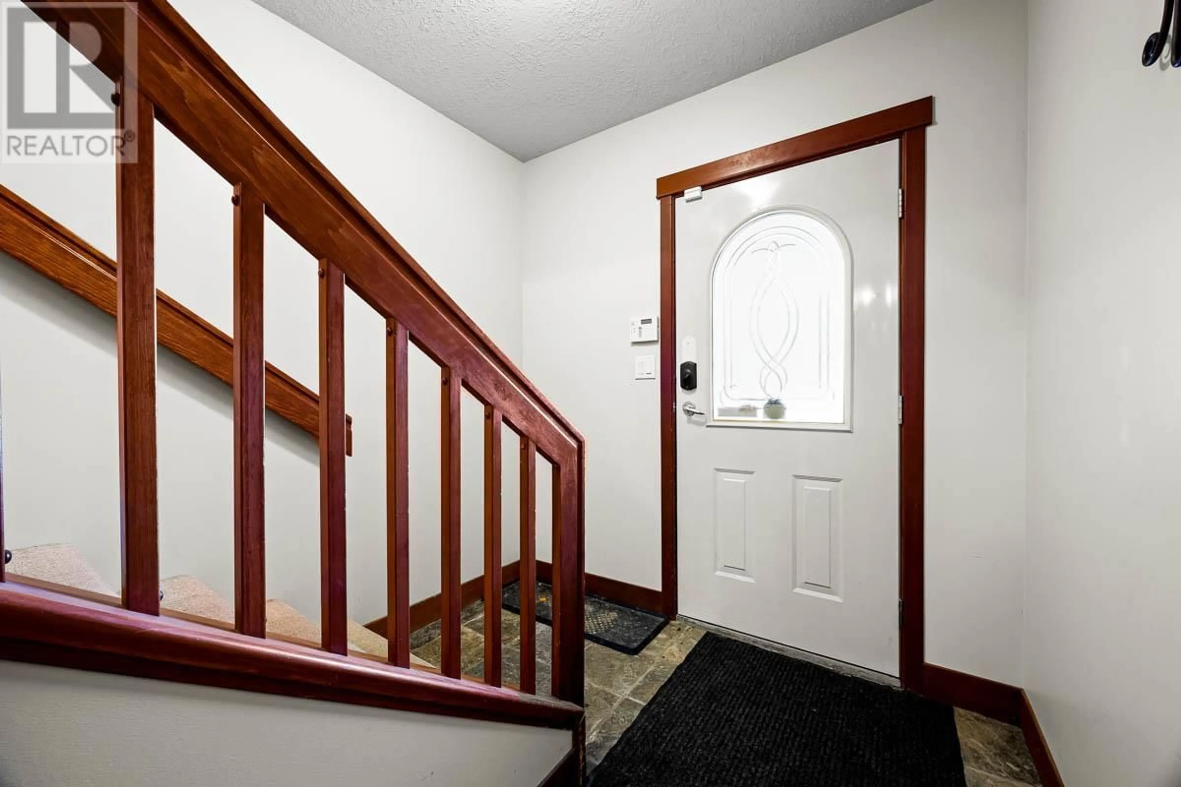 Indoor foyer, wood floors for 4030 Sundance Drive Unit# 2, Sun Peaks British Columbia V0E5N0