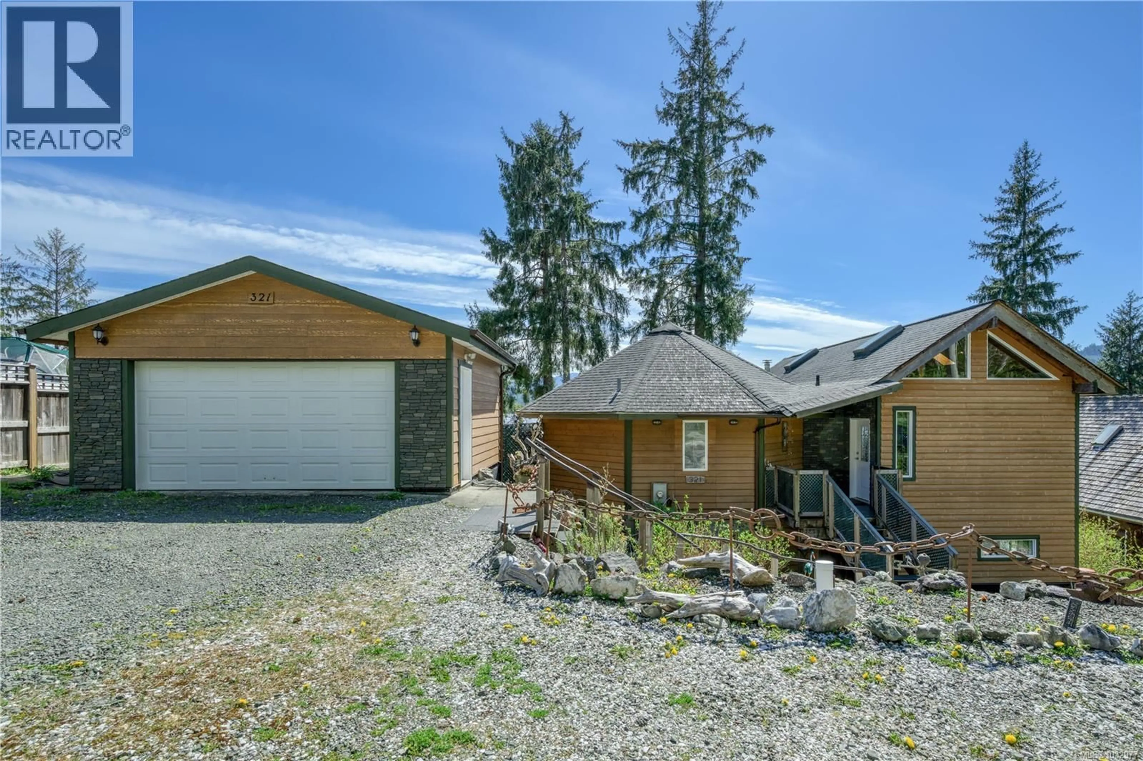 A pic from outside/outdoor area/front of a property/back of a property/a pic from drone, street for 321 HARBOUR ROAD, Coal Harbour British Columbia V0N1K0