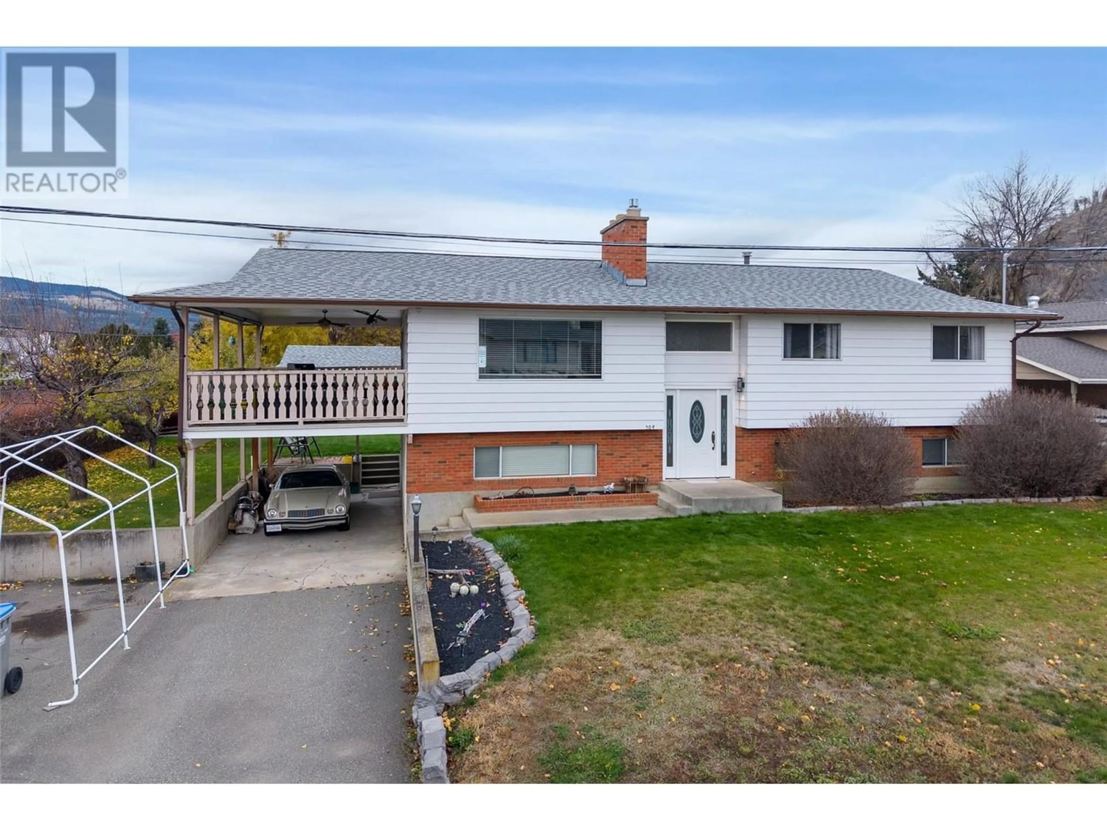 Frontside or backside of a home, the fenced backyard for 304 MONTEGO Road, Kamloops British Columbia V2H1N1