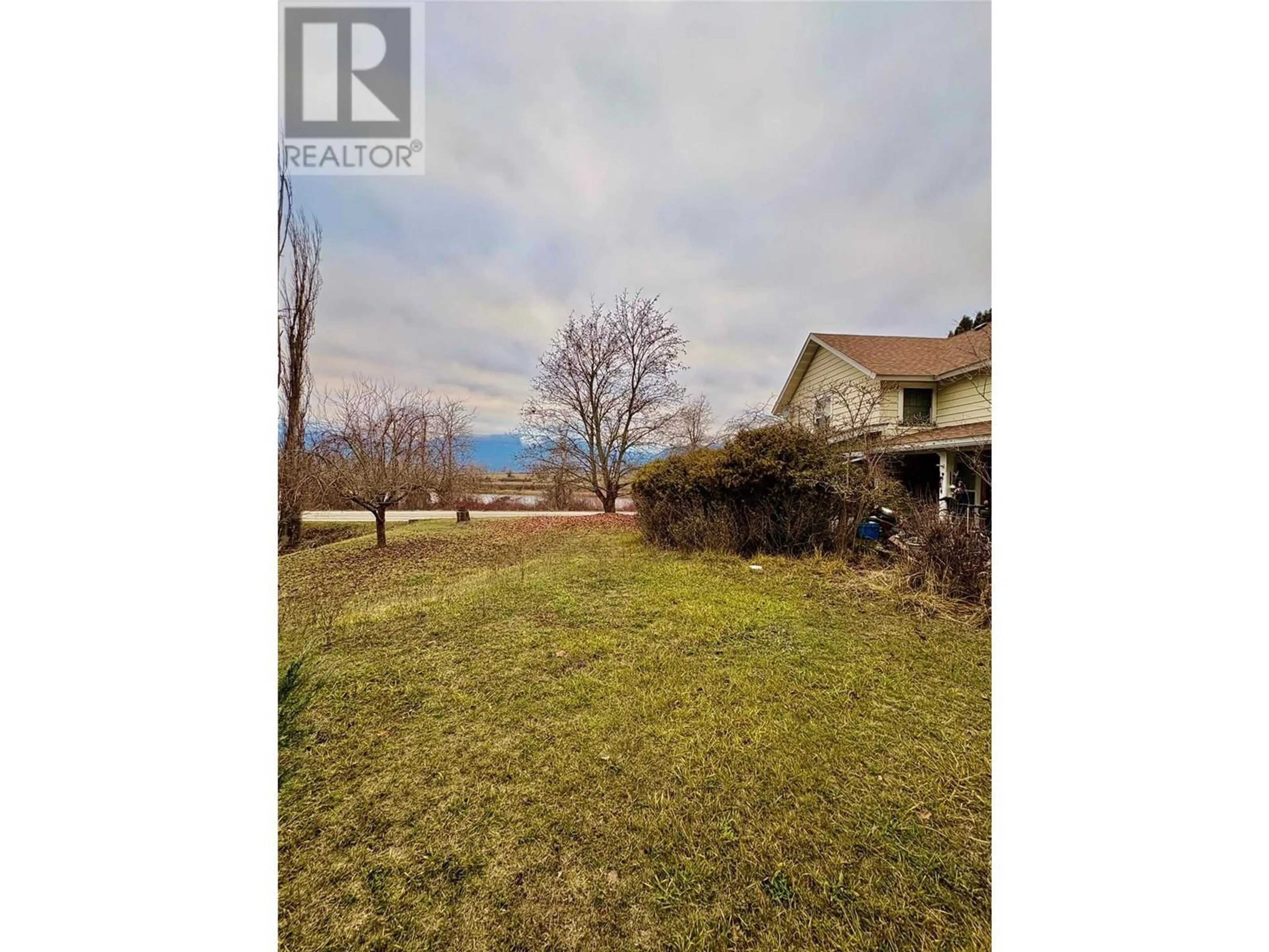 A pic from outside/outdoor area/front of a property/back of a property/a pic from drone, water/lake/river/ocean view for 340 HIGHWAY 21 HIGHWAY, Creston British Columbia V0B1G2