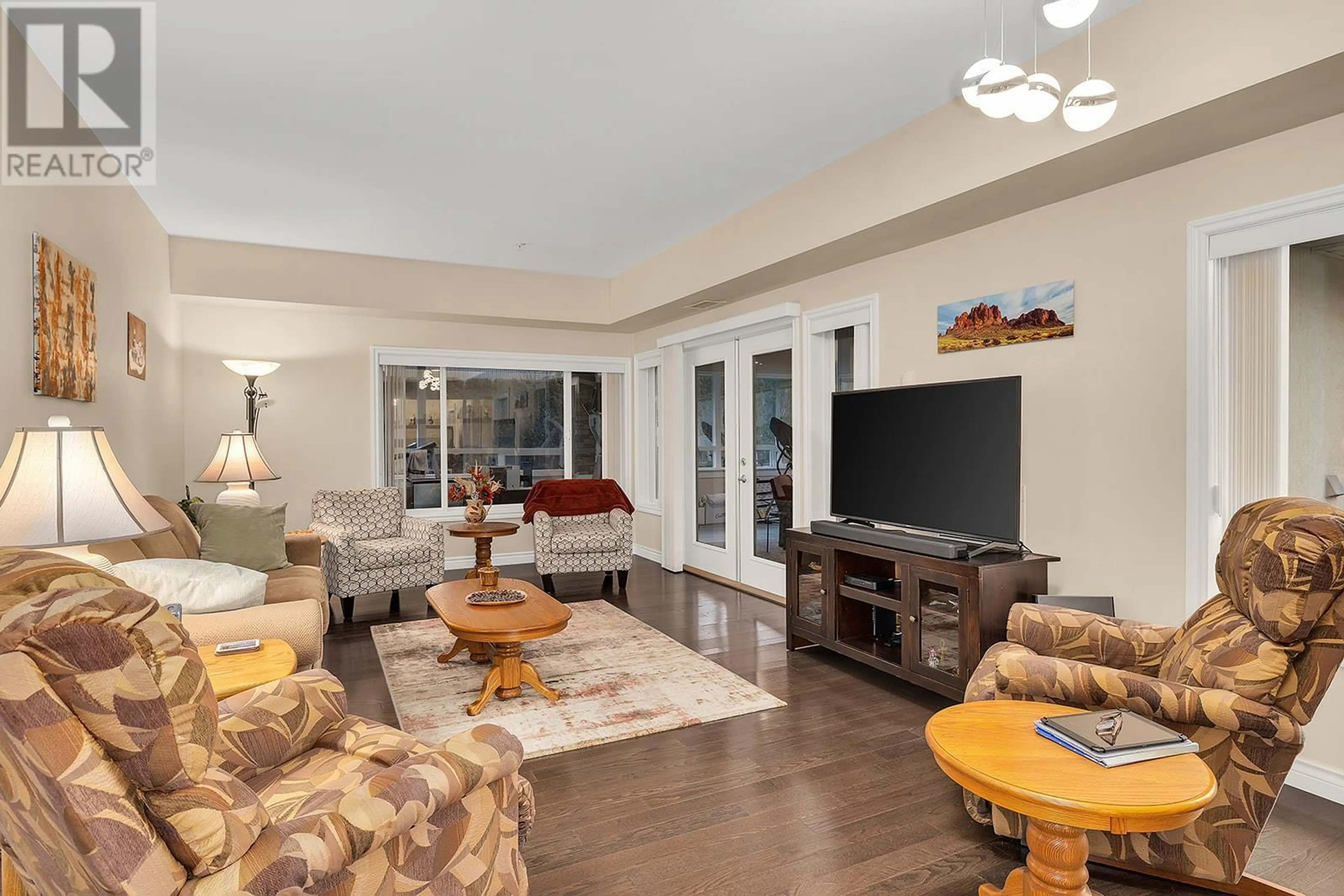 Living room with furniture, unknown for 1961 Durnin Road Unit# 105, Kelowna British Columbia V1X7Z6