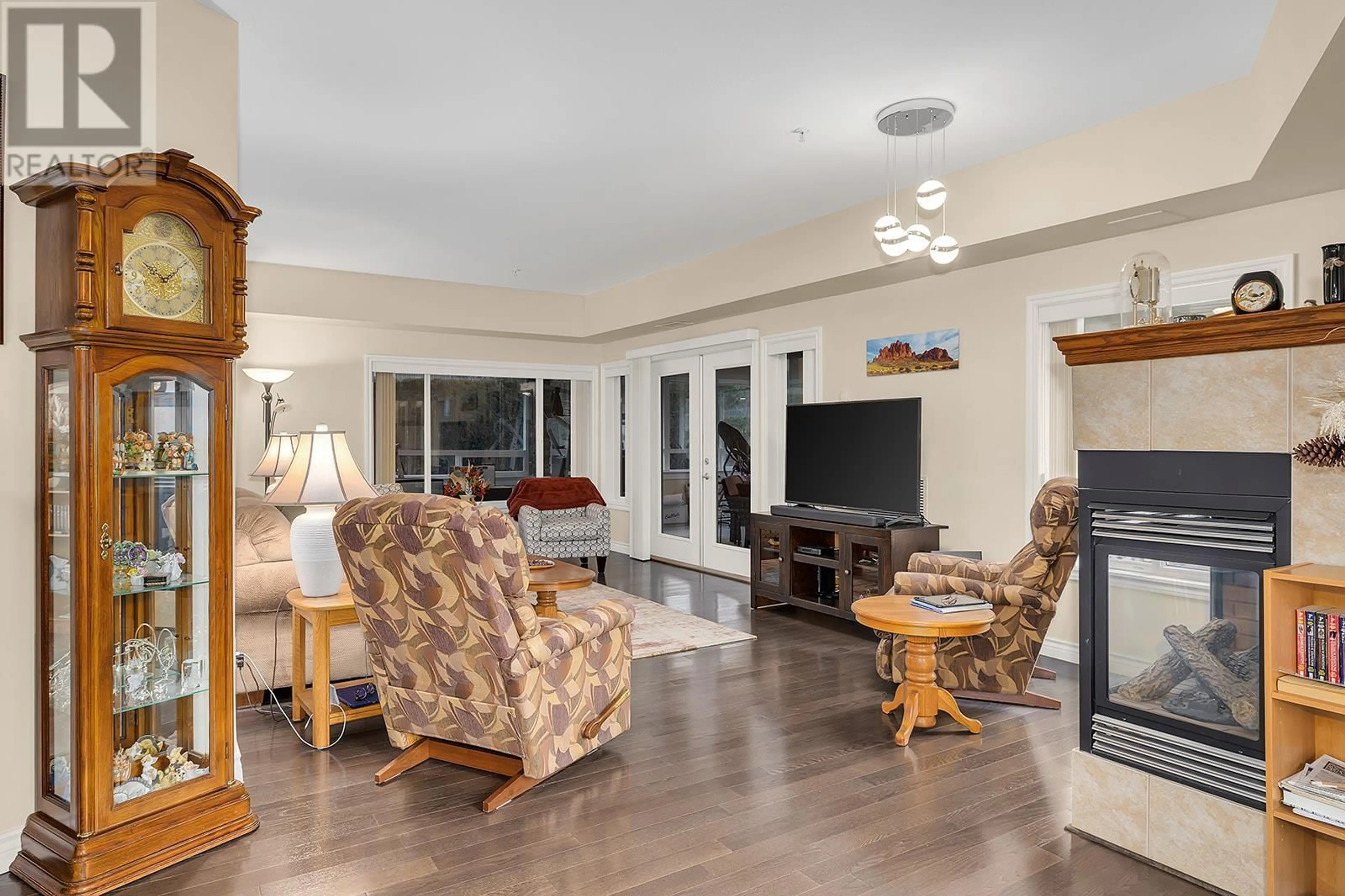 Living room with furniture, unknown for 1961 Durnin Road Unit# 105, Kelowna British Columbia V1X7Z6