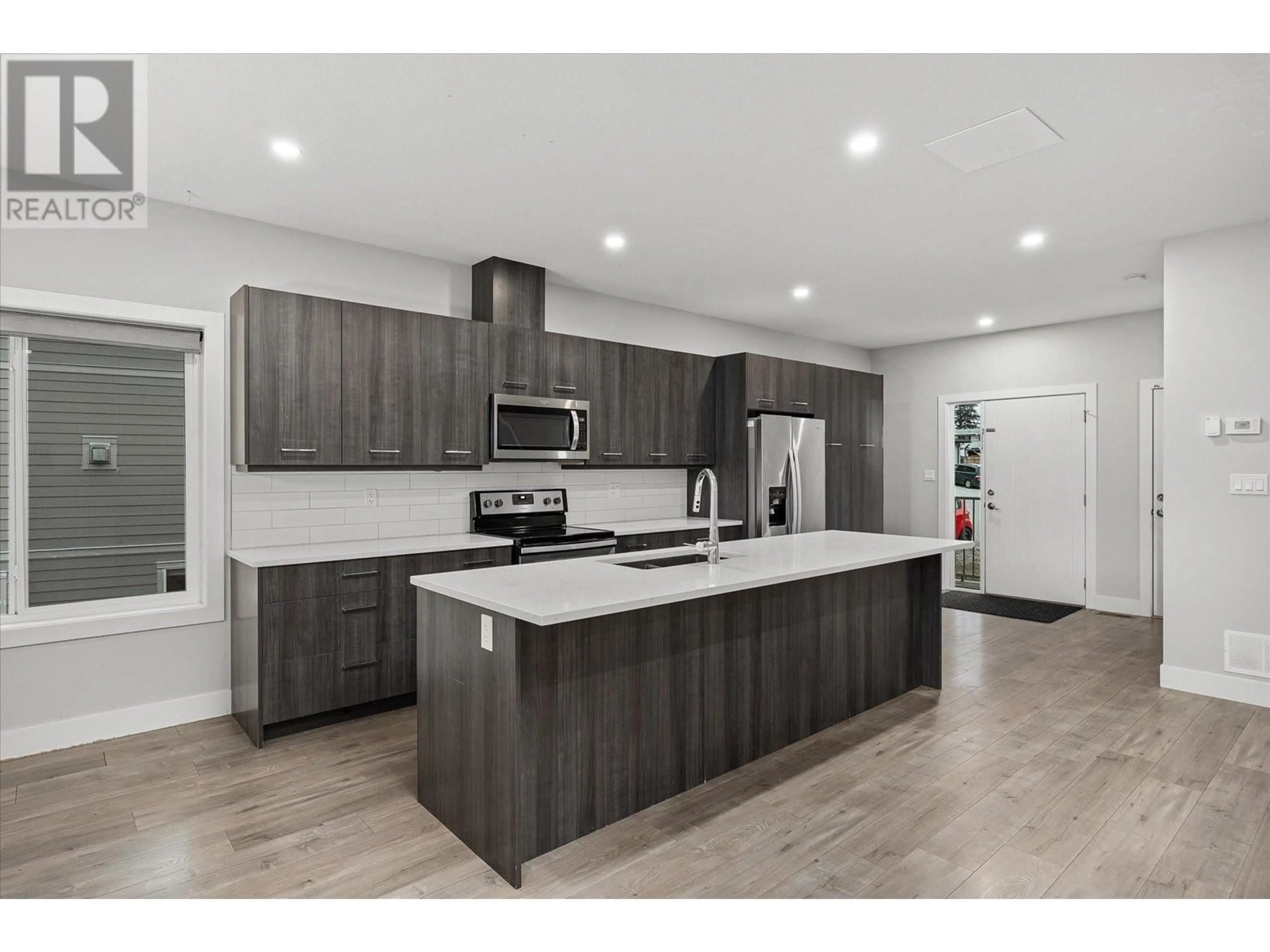 Open concept kitchen for 3737 Inverness Road, West Kelowna British Columbia V4T3N2