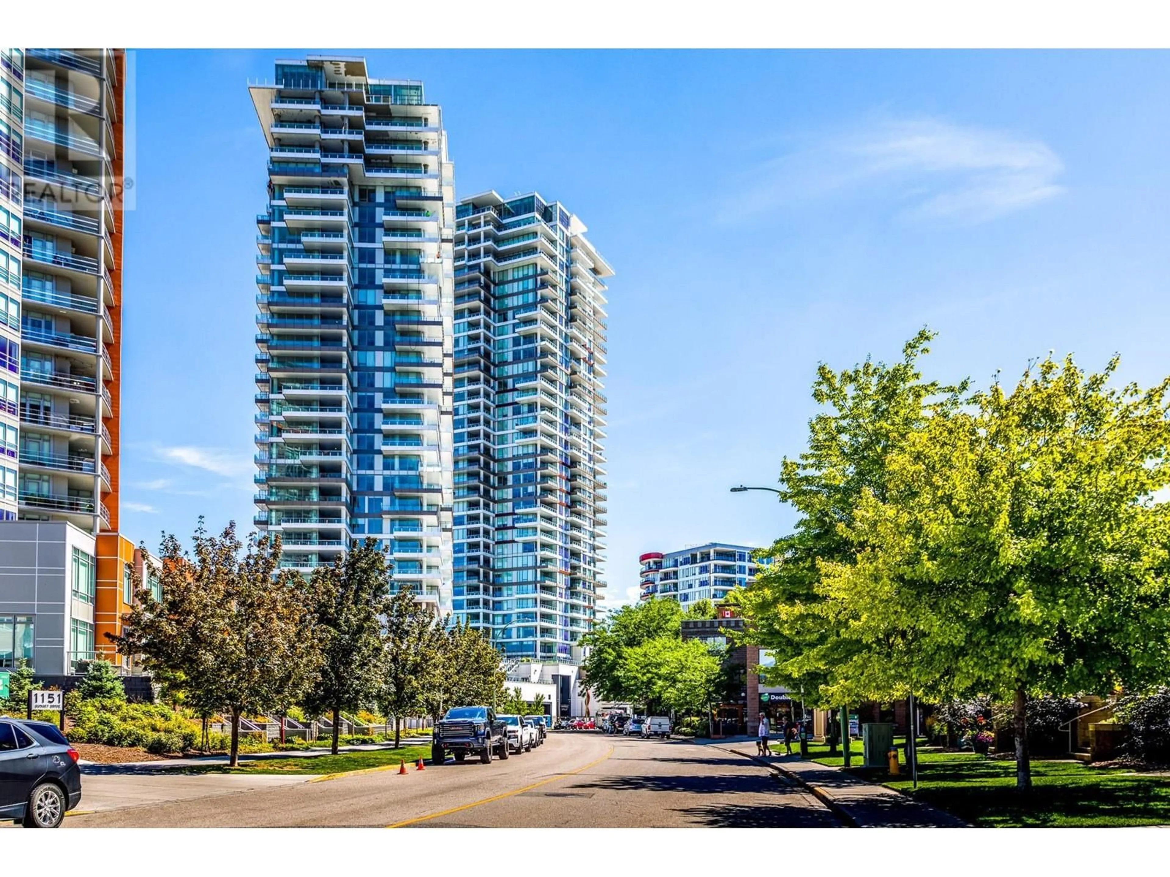 A pic from exterior of the house or condo, the street view for 1181 Sunset Drive Unit# 1002, Kelowna British Columbia V1Y0J5