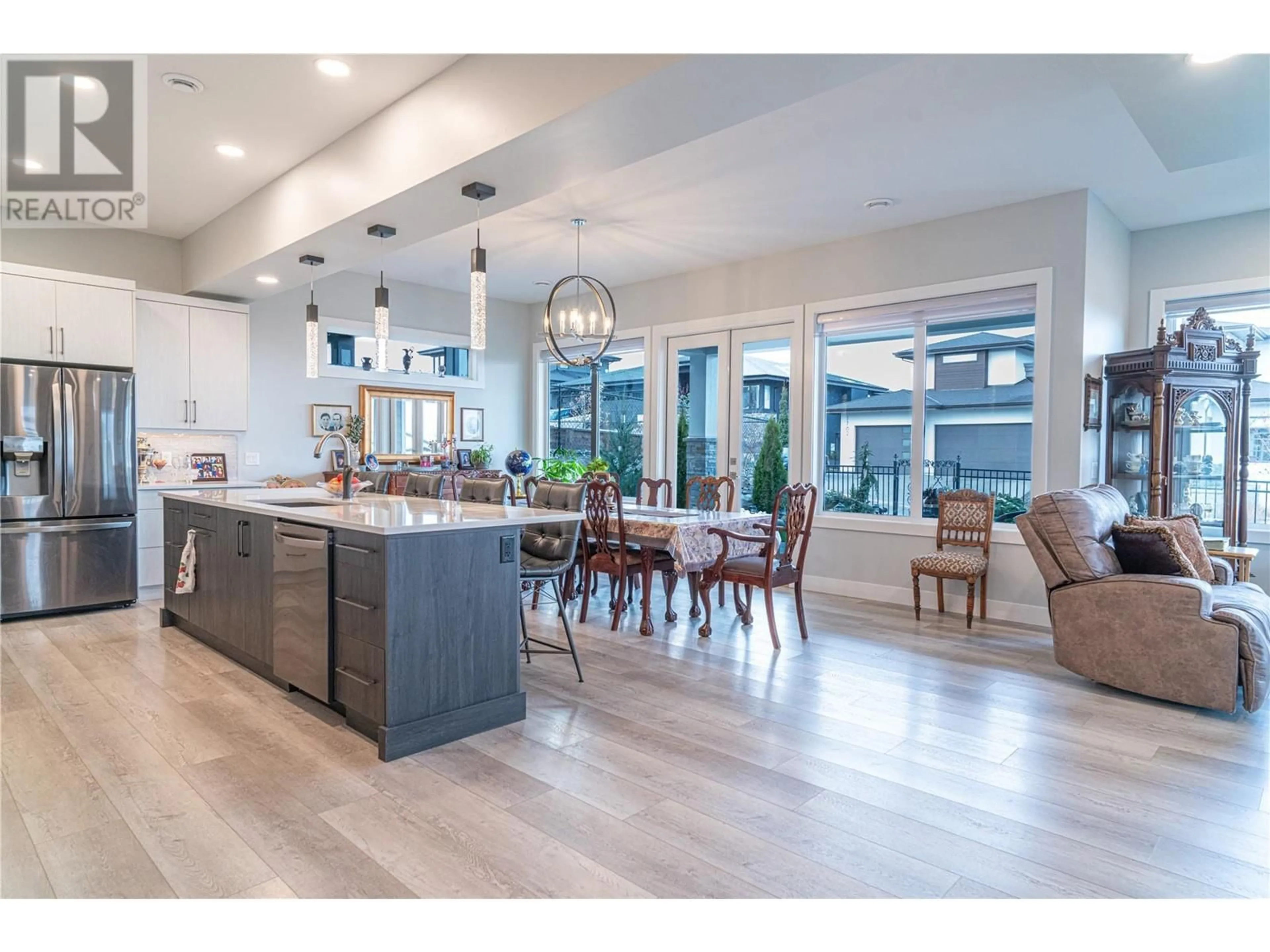 Open concept kitchen, wood/laminate floor for 540 BARRA LANE, Kelowna British Columbia V1P1T1