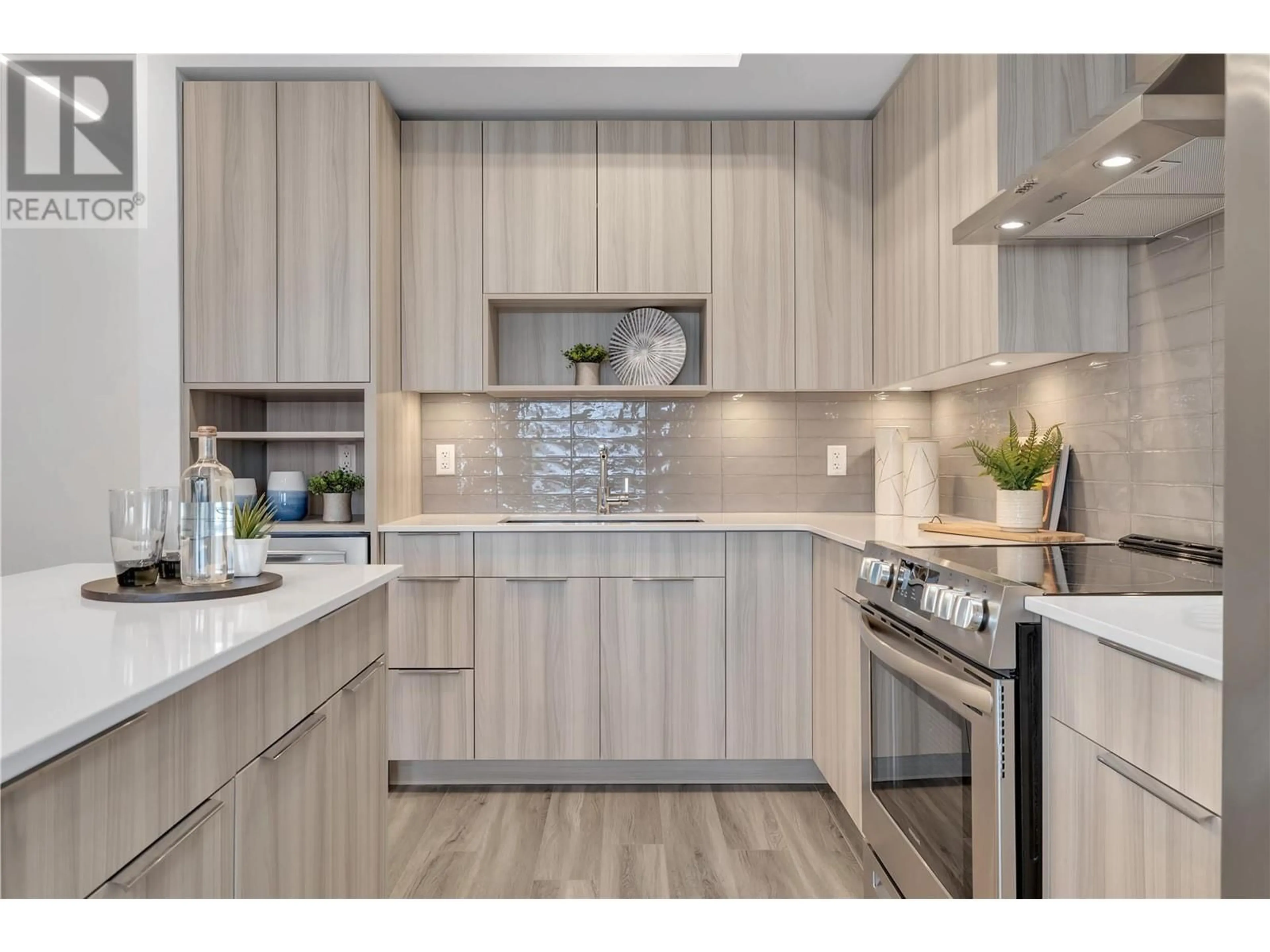 Open concept kitchen, wood/laminate floor for 601B - 3634 MISSION SPRINGS DRIVE, Kelowna British Columbia V1W0C9