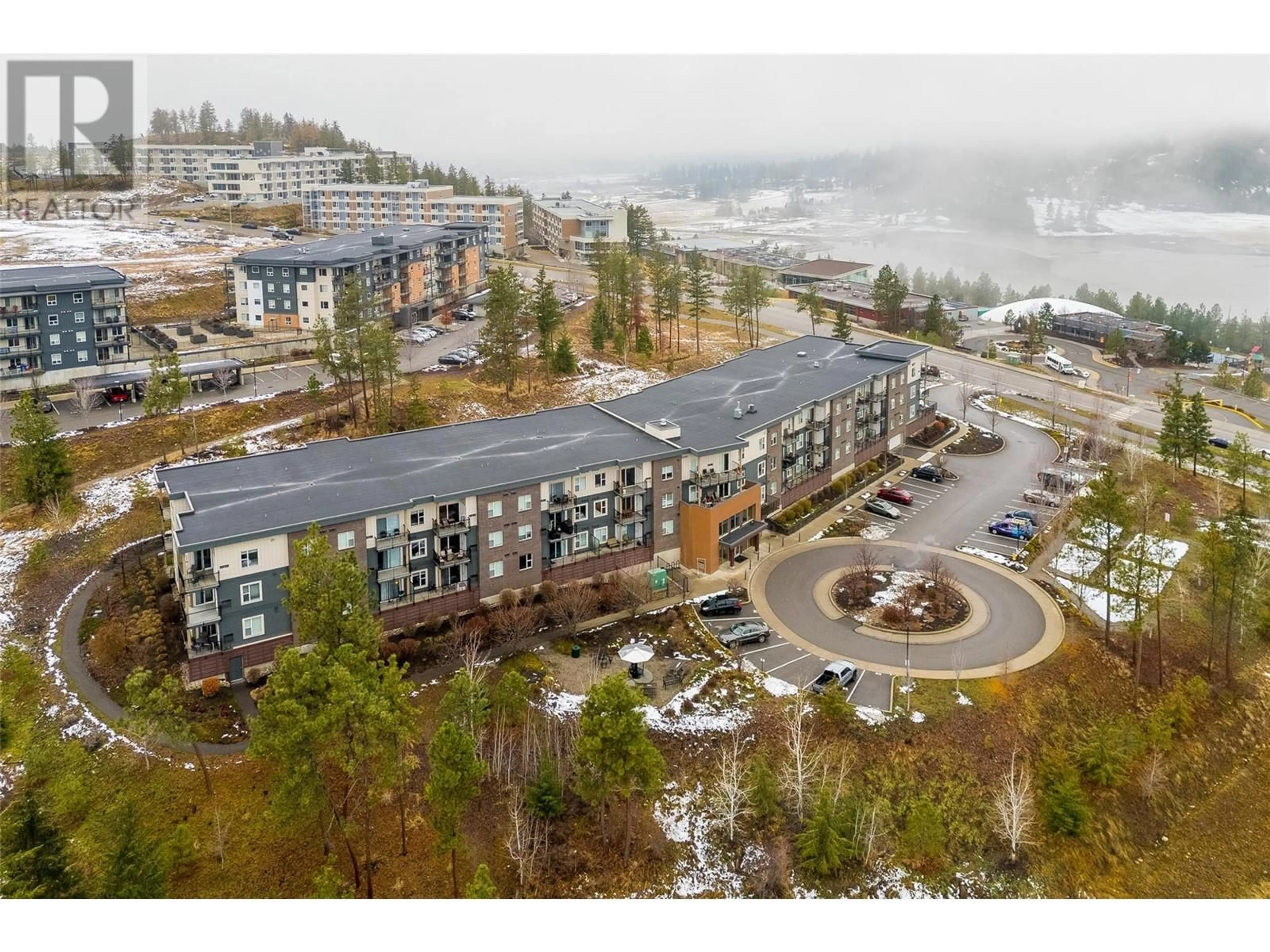 A pic from outside/outdoor area/front of a property/back of a property/a pic from drone, mountain view for 935 Academy Way Unit# 212, Kelowna British Columbia V1V3C8