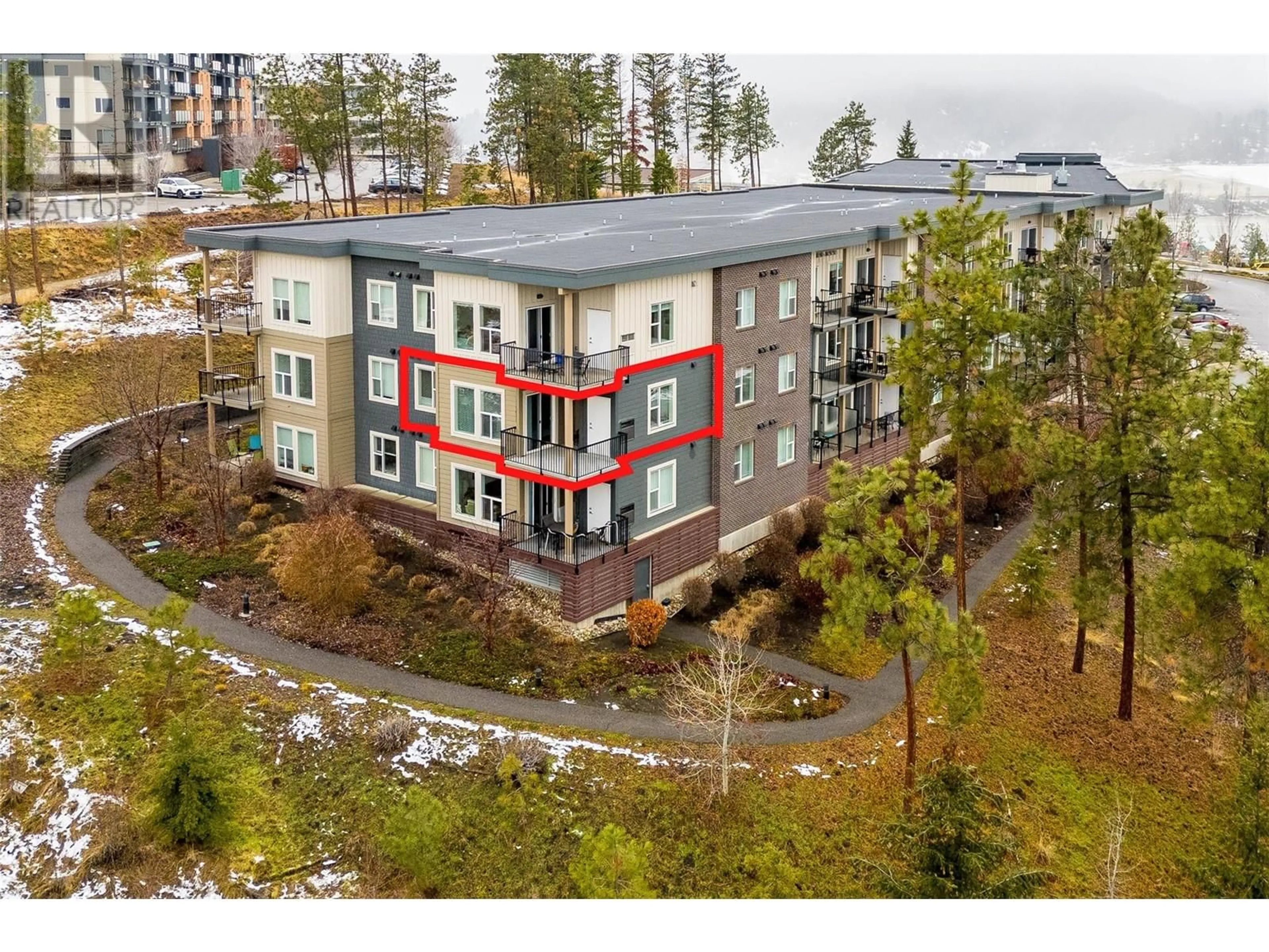 A pic from outside/outdoor area/front of a property/back of a property/a pic from drone, unknown for 935 Academy Way Unit# 212, Kelowna British Columbia V1V3C8