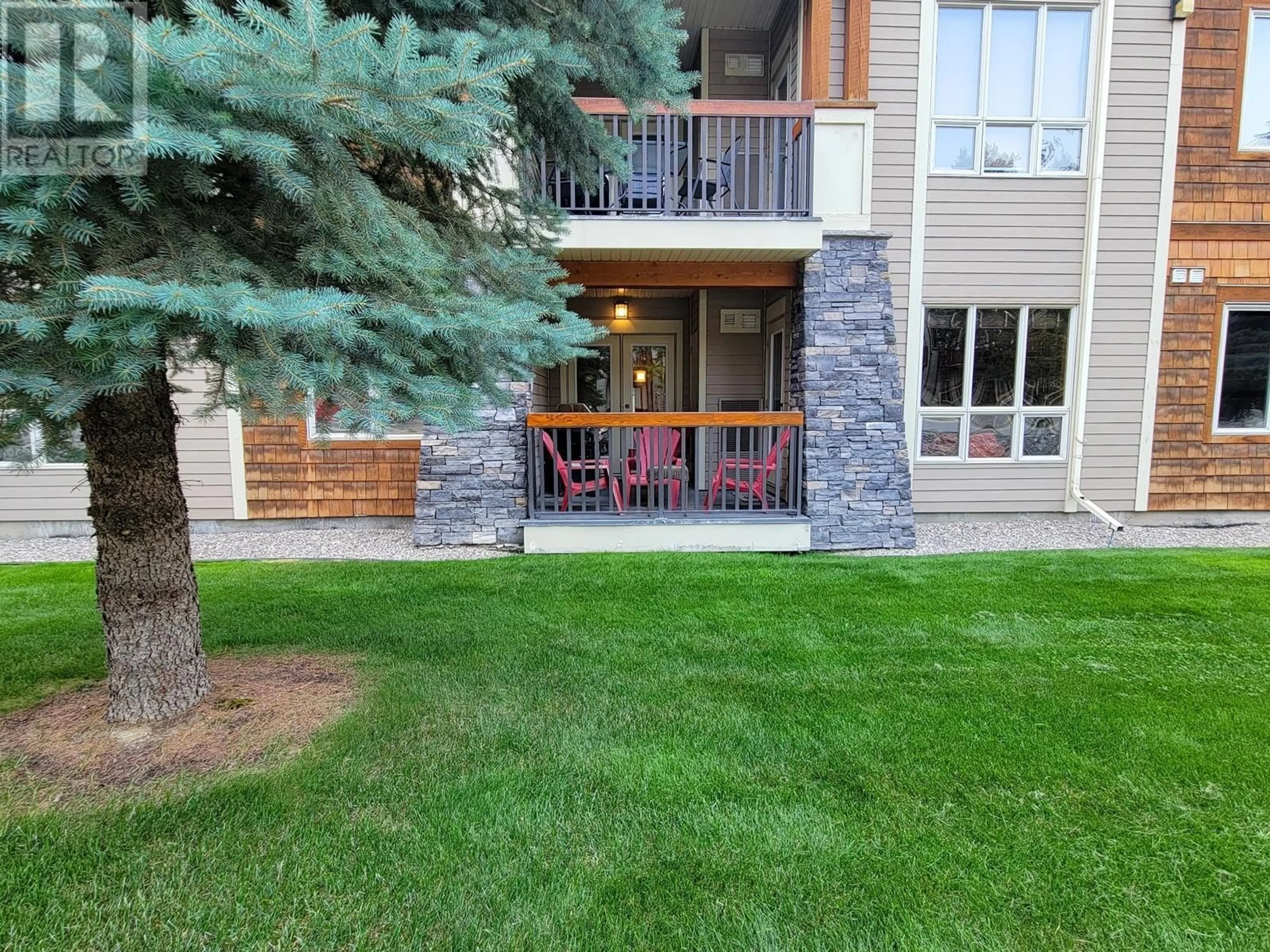 A pic from exterior of the house or condo, the fenced backyard for 7495 COLUMBIA Avenue Unit# 1109, Radium Hot Springs British Columbia V0A1M0