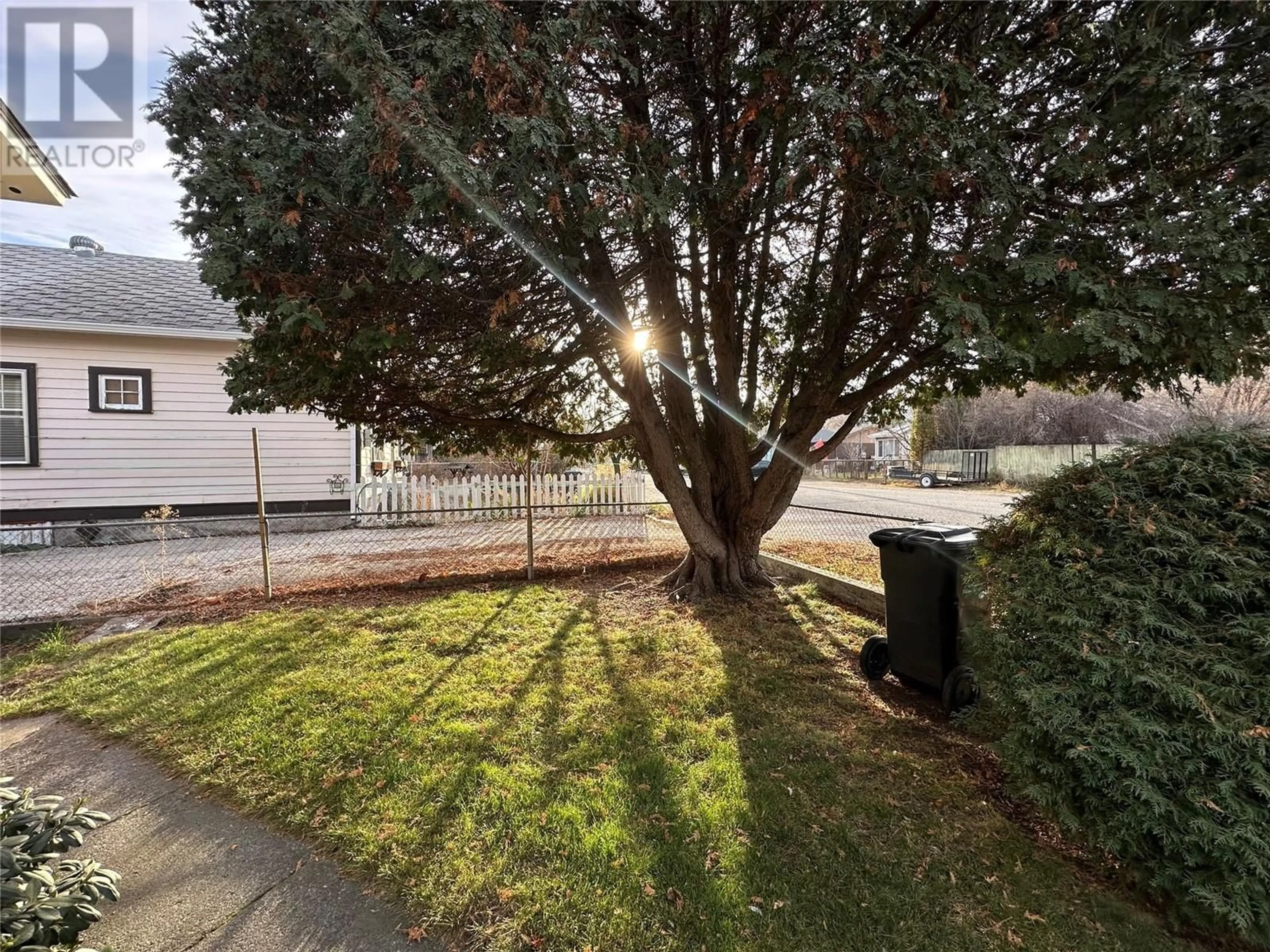 A pic from exterior of the house or condo, the fenced backyard for 702 Brink Street, Ashcroft British Columbia V0K1A0