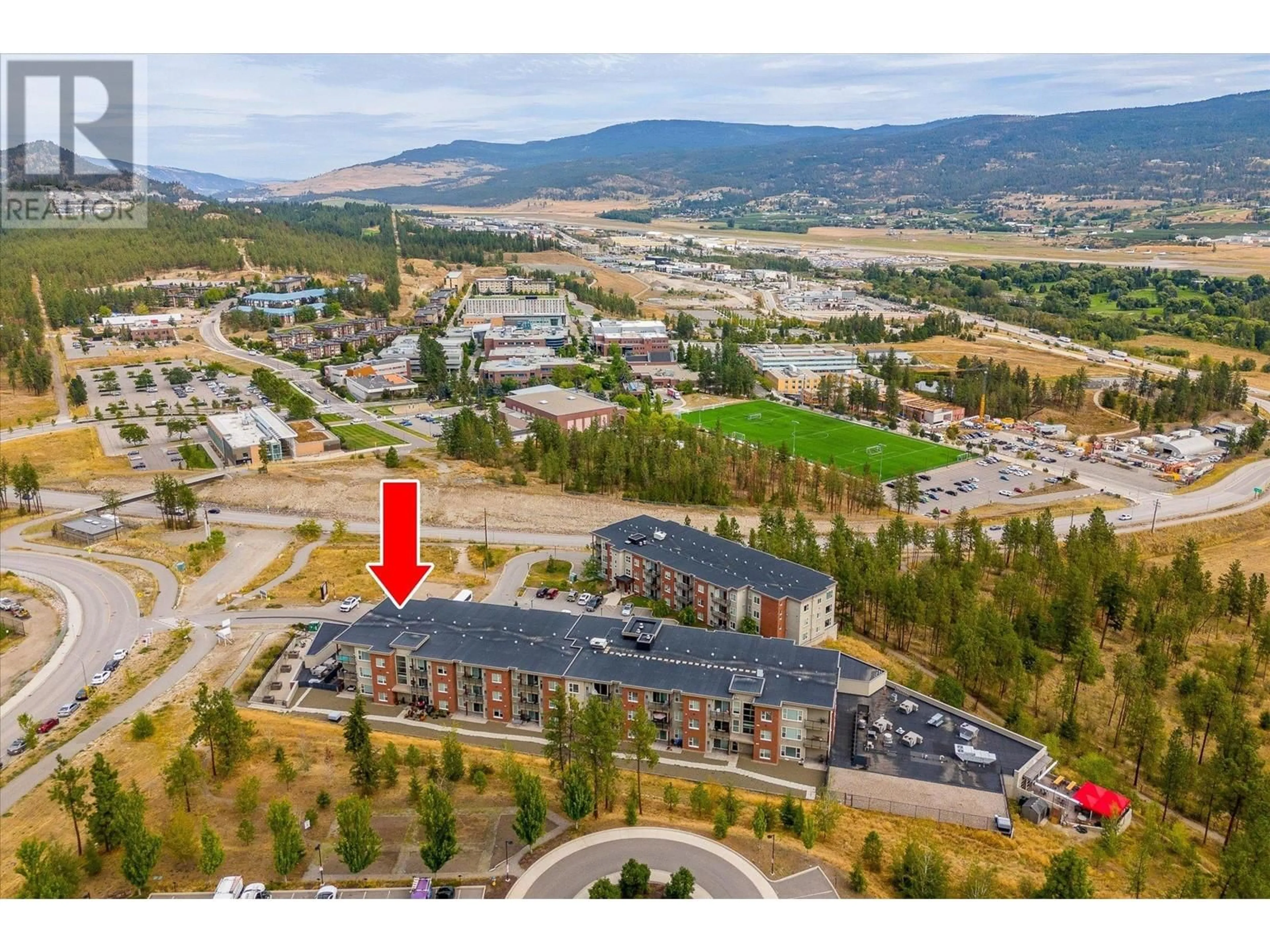 A pic from exterior of the house or condo, the street view for 975 Academy Way Unit# 301, Kelowna British Columbia V1V3C8