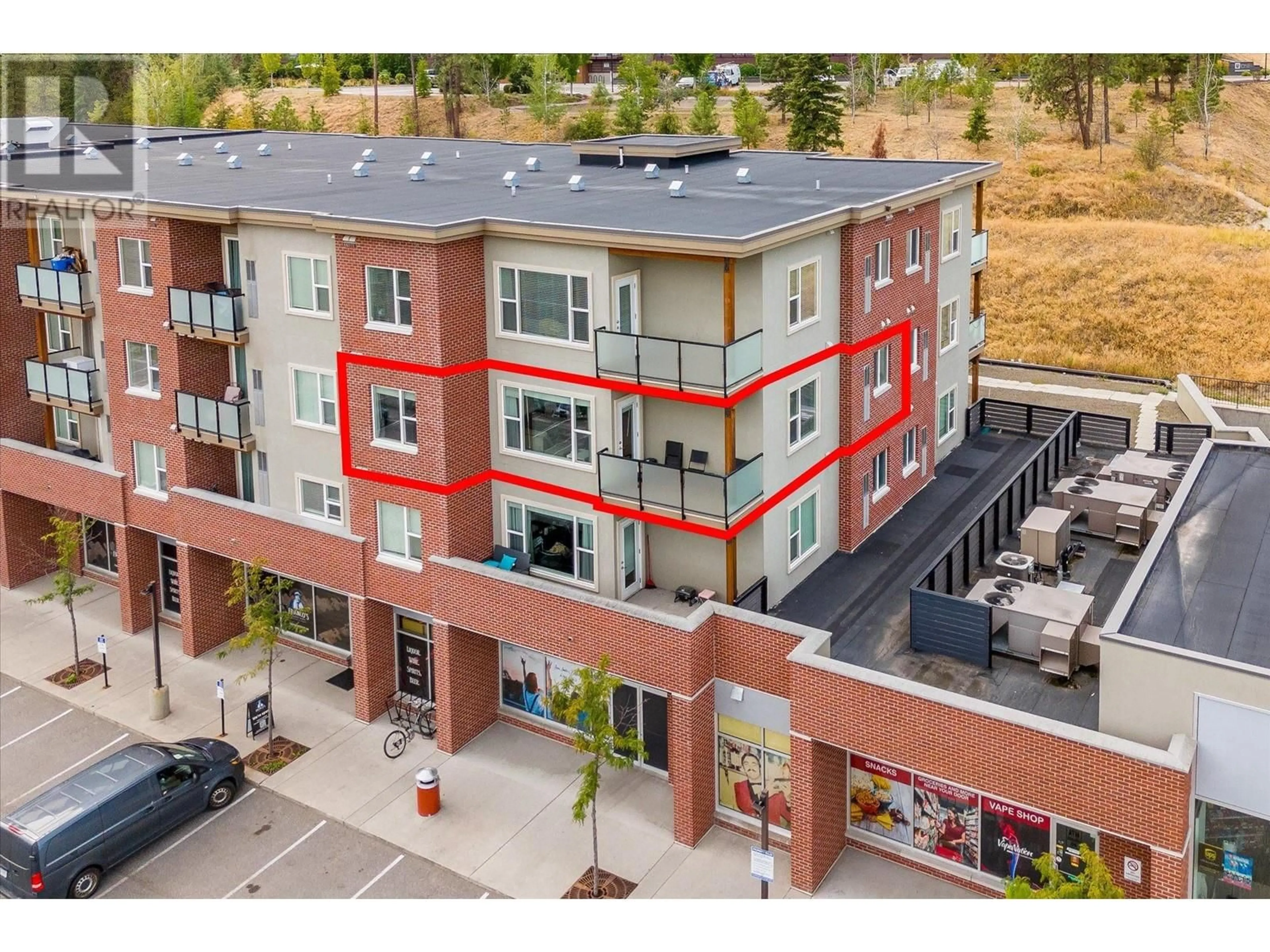 A pic from exterior of the house or condo, the front or back of building for 975 Academy Way Unit# 301, Kelowna British Columbia V1V3C8