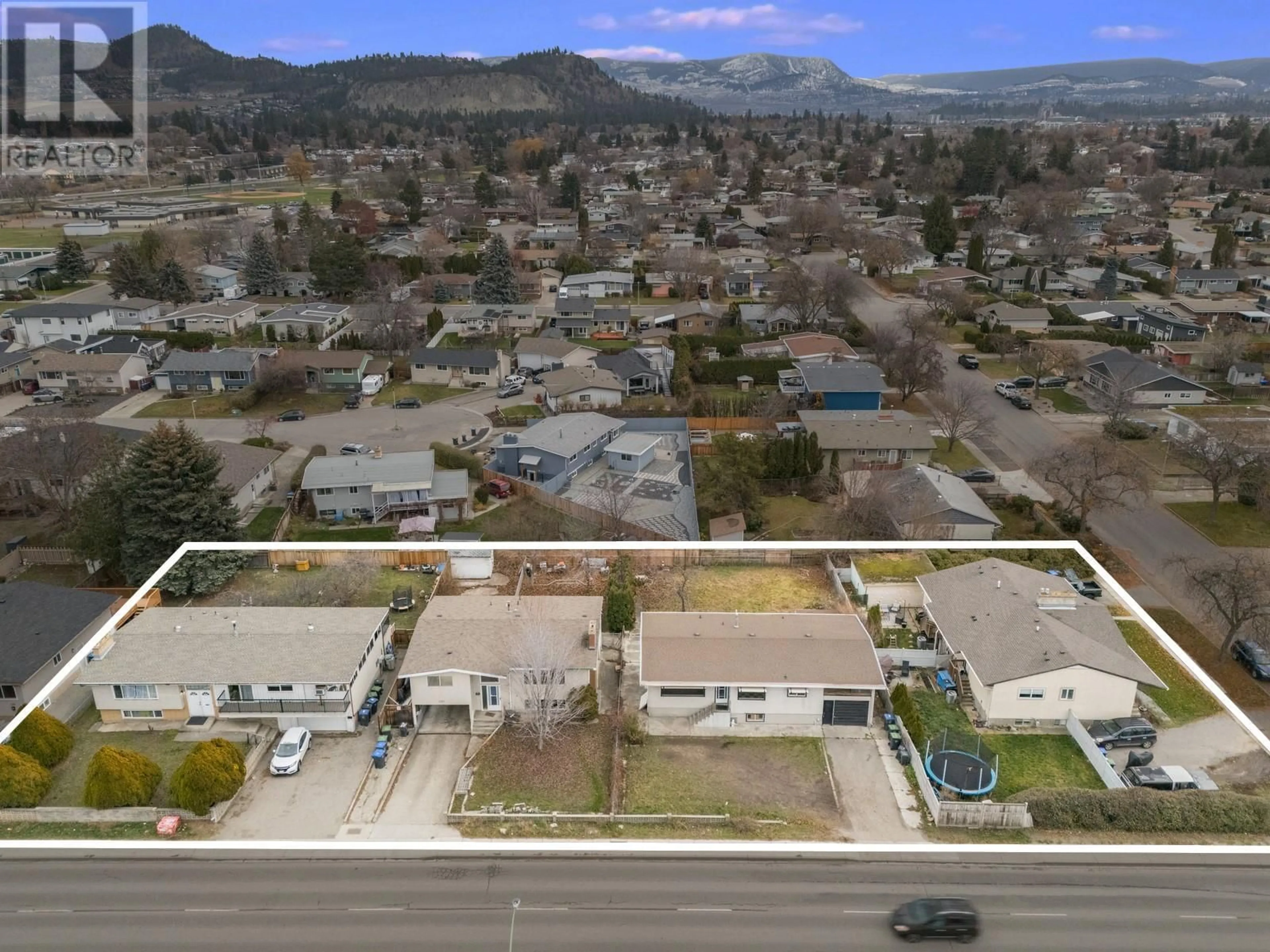 A pic from outside/outdoor area/front of a property/back of a property/a pic from drone, mountain view for 1387 Gordon Drive, Kelowna British Columbia V1Y3E9