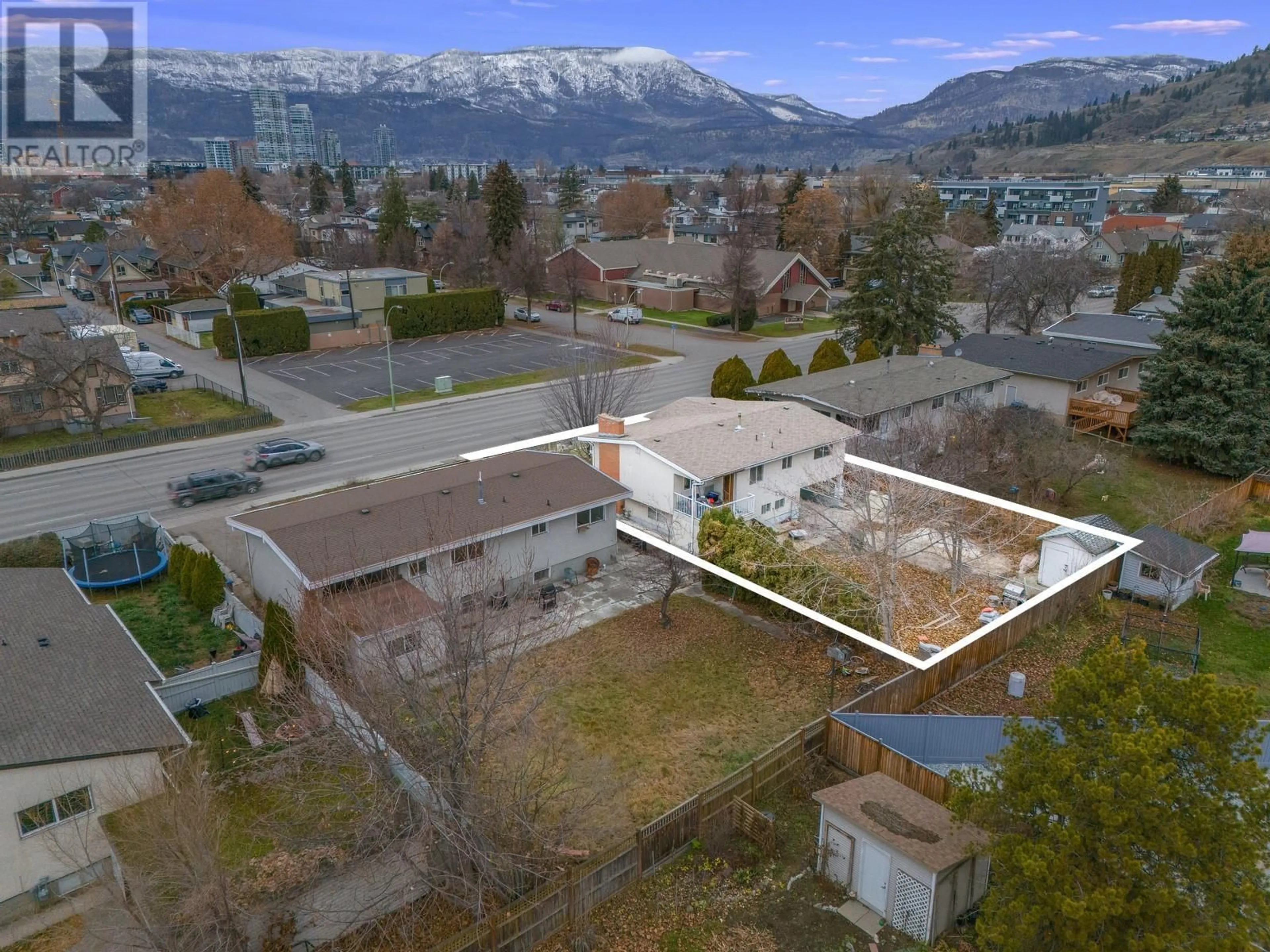 A pic from outside/outdoor area/front of a property/back of a property/a pic from drone, mountain view for 1387 Gordon Drive, Kelowna British Columbia V1Y3E9