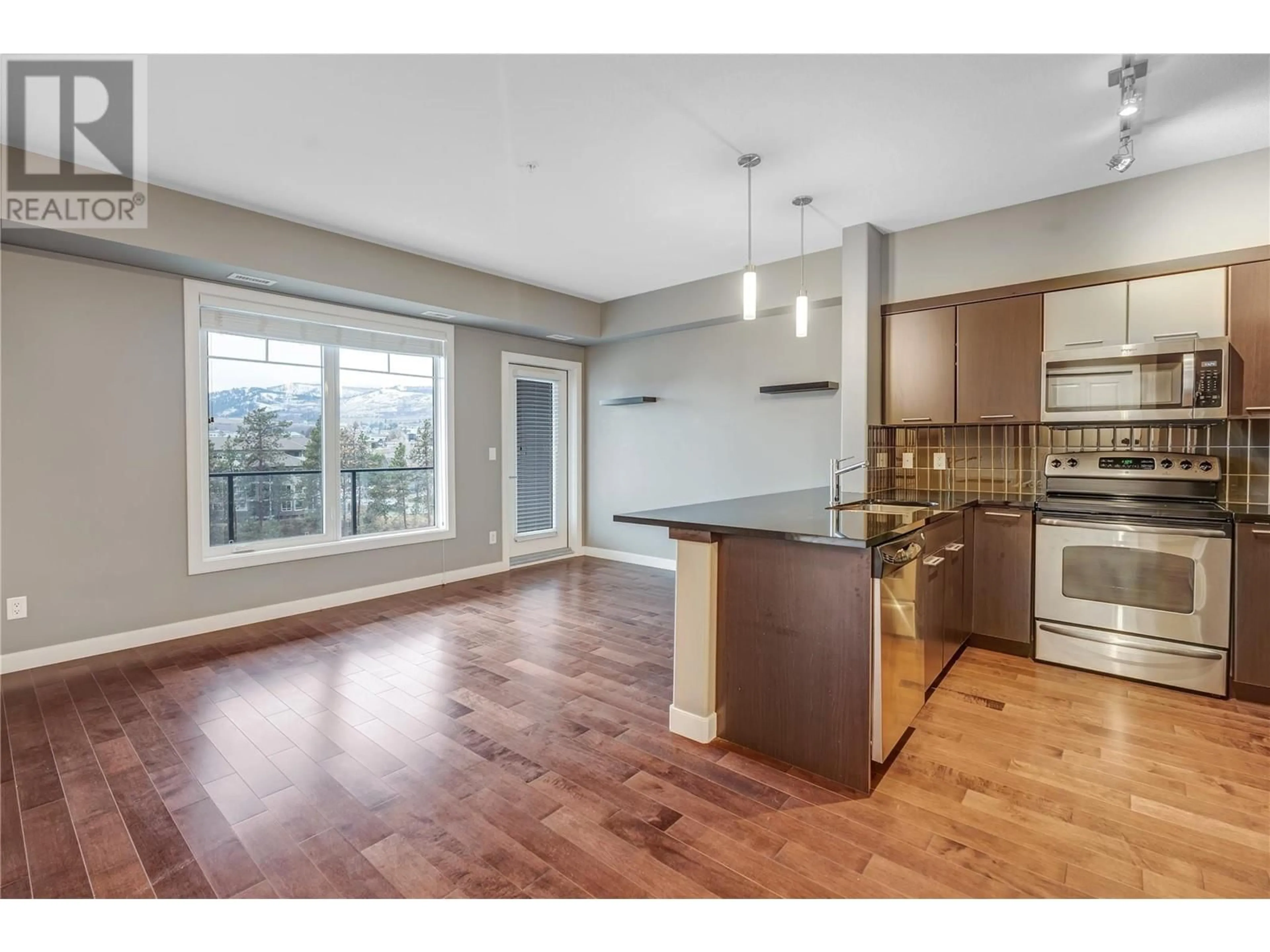 Open concept kitchen, wood/laminate floor for 513 - 3645 CARRINGTON ROAD, West Kelowna British Columbia V4T2C2