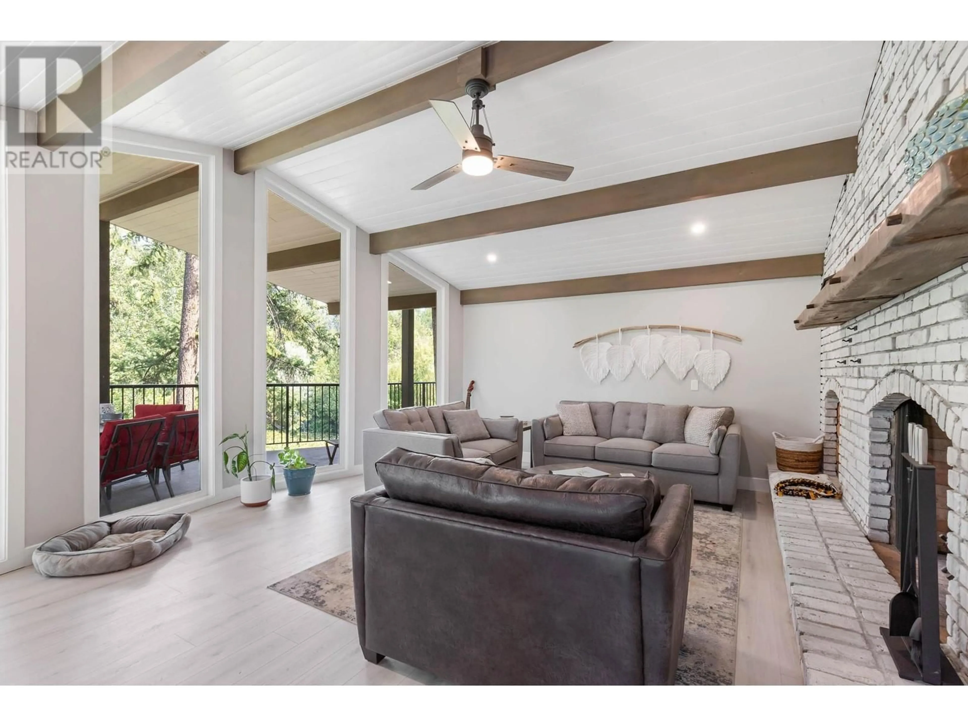 Living room, wood floors for 2455 Maquinna Road, Kelowna British Columbia V1W2R9