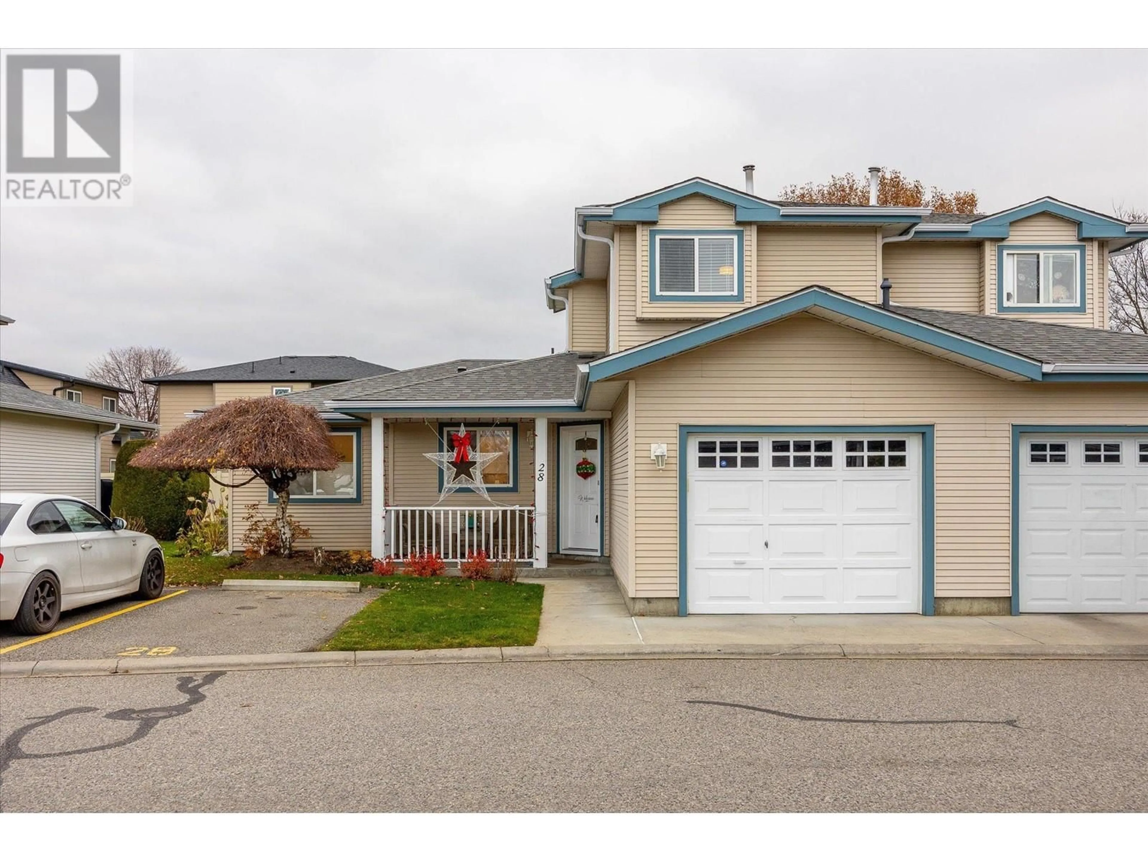 A pic from exterior of the house or condo, the street view for 1120 Guisachan Road Unit# 28, Kelowna British Columbia V1Y9R5