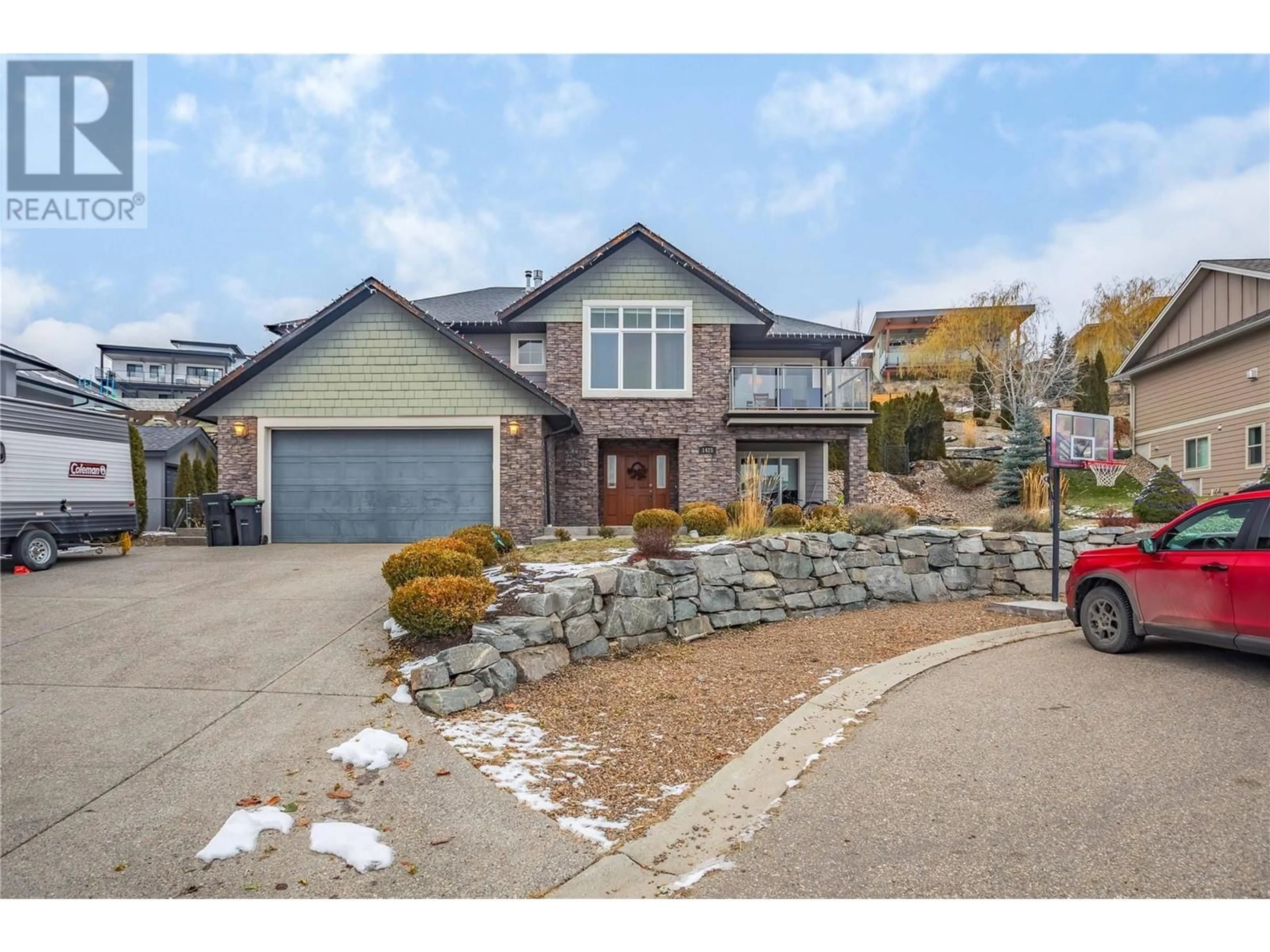 Frontside or backside of a home, the street view for 1425 Red Mountain Place, Vernon British Columbia V1B4A3