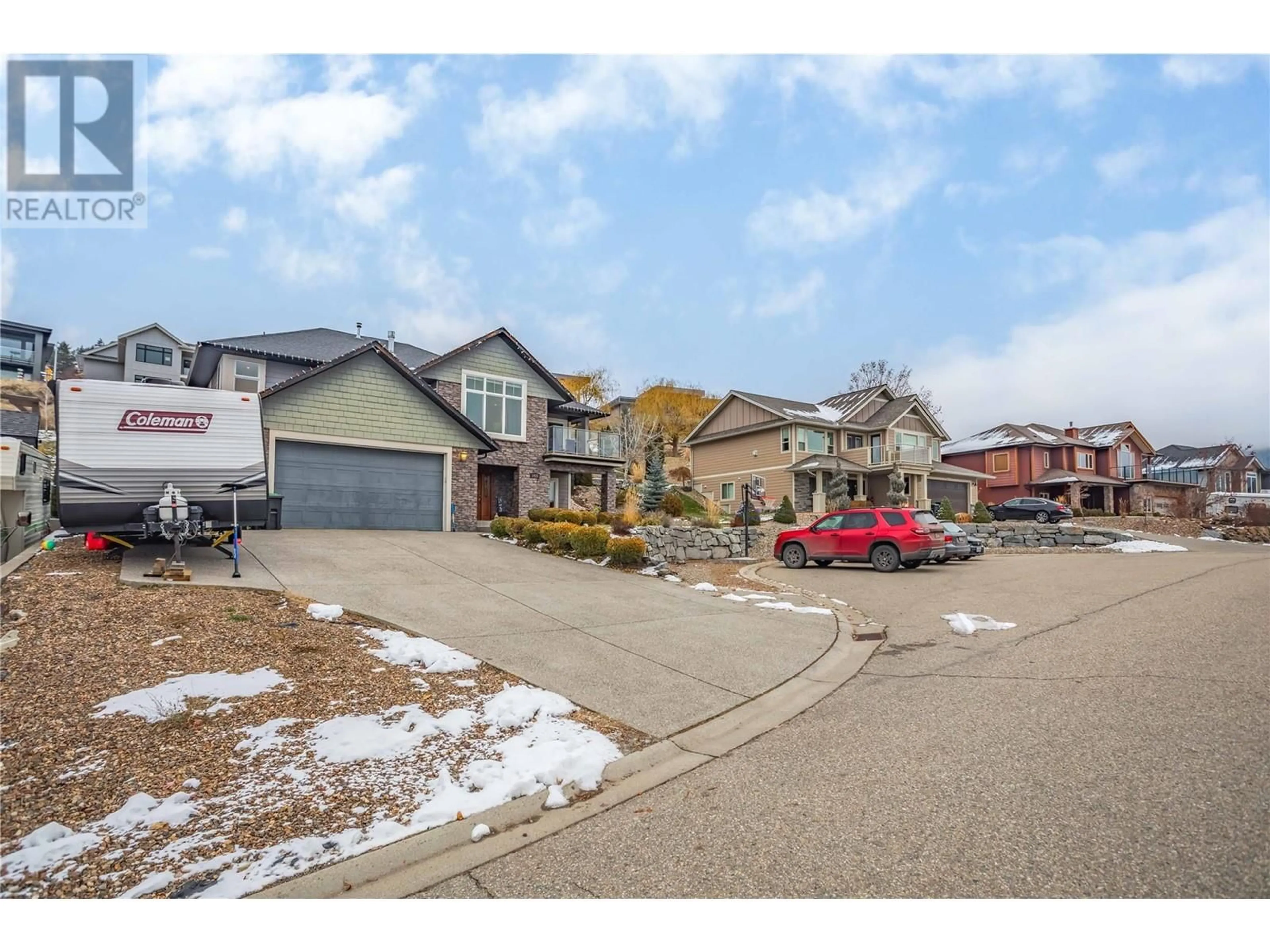 Frontside or backside of a home, the street view for 1425 Red Mountain Place, Vernon British Columbia V1B4A3