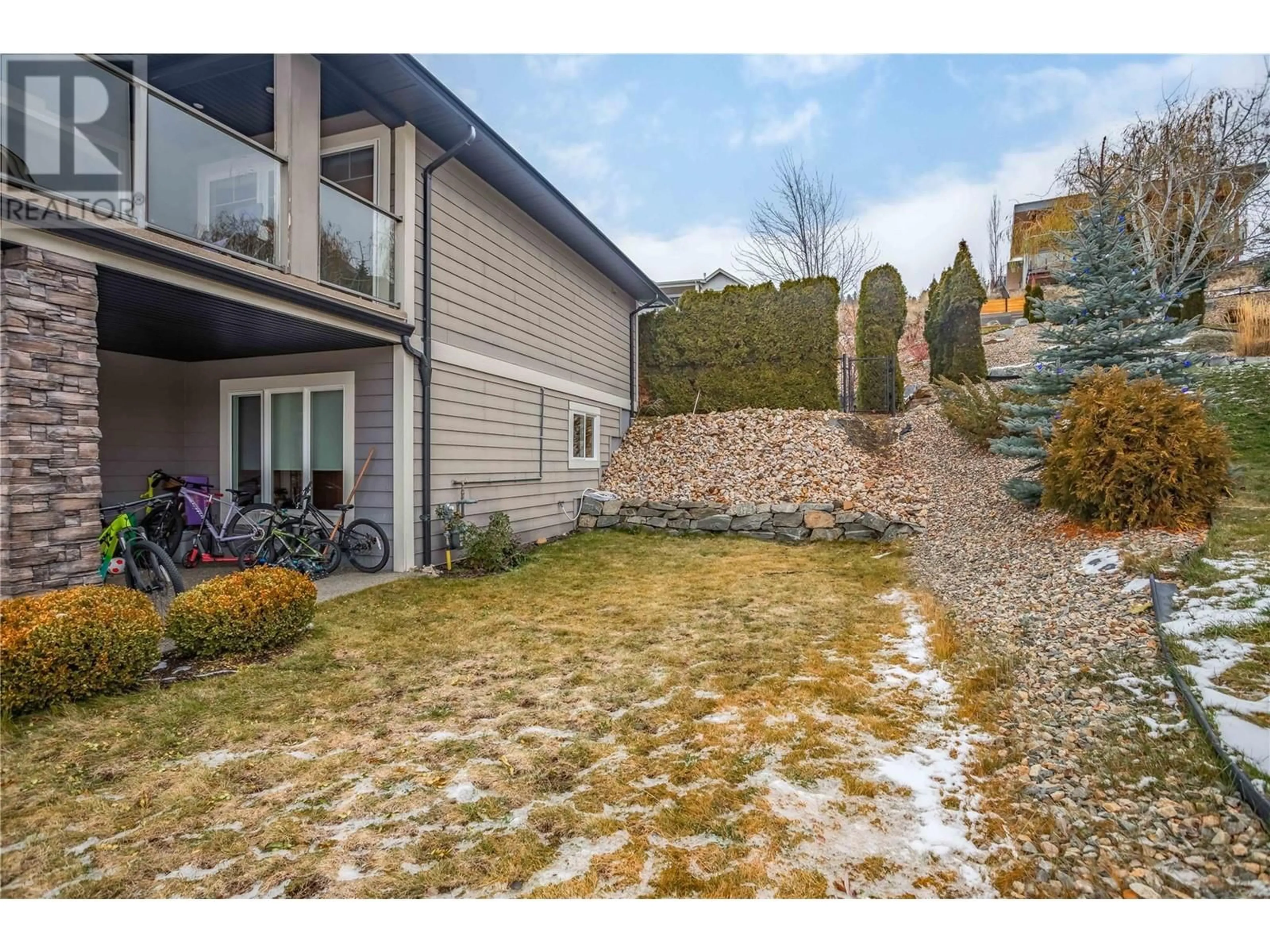 A pic from exterior of the house or condo, the fenced backyard for 1425 Red Mountain Place, Vernon British Columbia V1B4A3