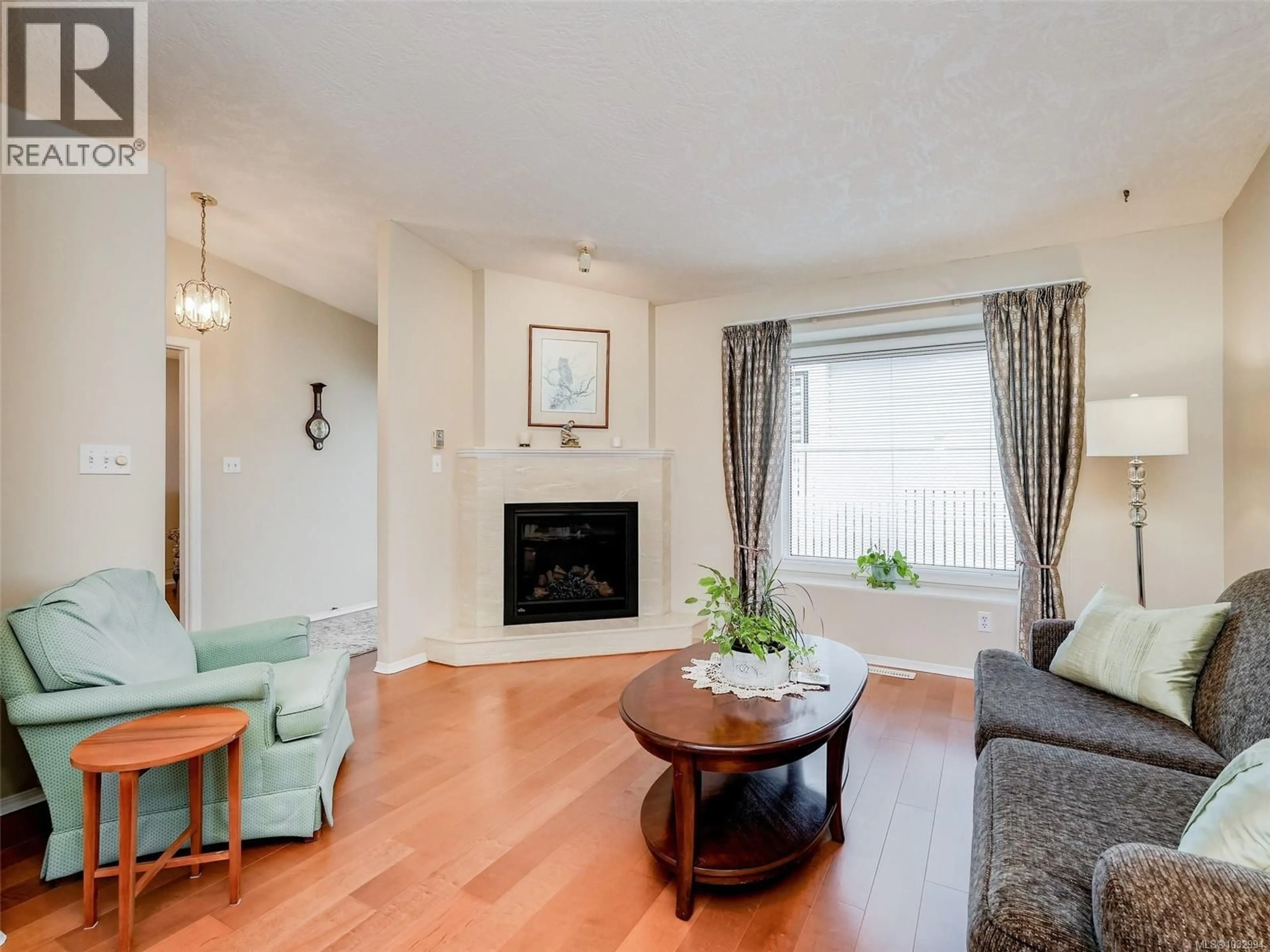 Living room with furniture, wood/laminate floor for 13 EAGLE LANE, View Royal British Columbia V9A7M2